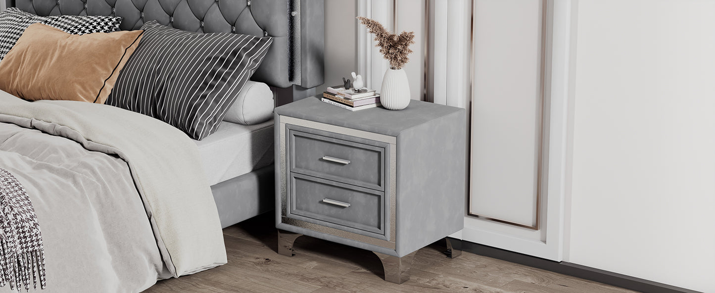 Gray velvet nightstand with two drawers and chrome handles