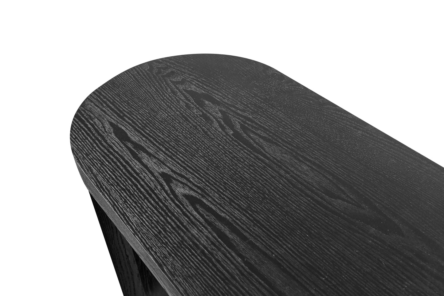 Closeup of a rounded edge of a dark wood dining table
