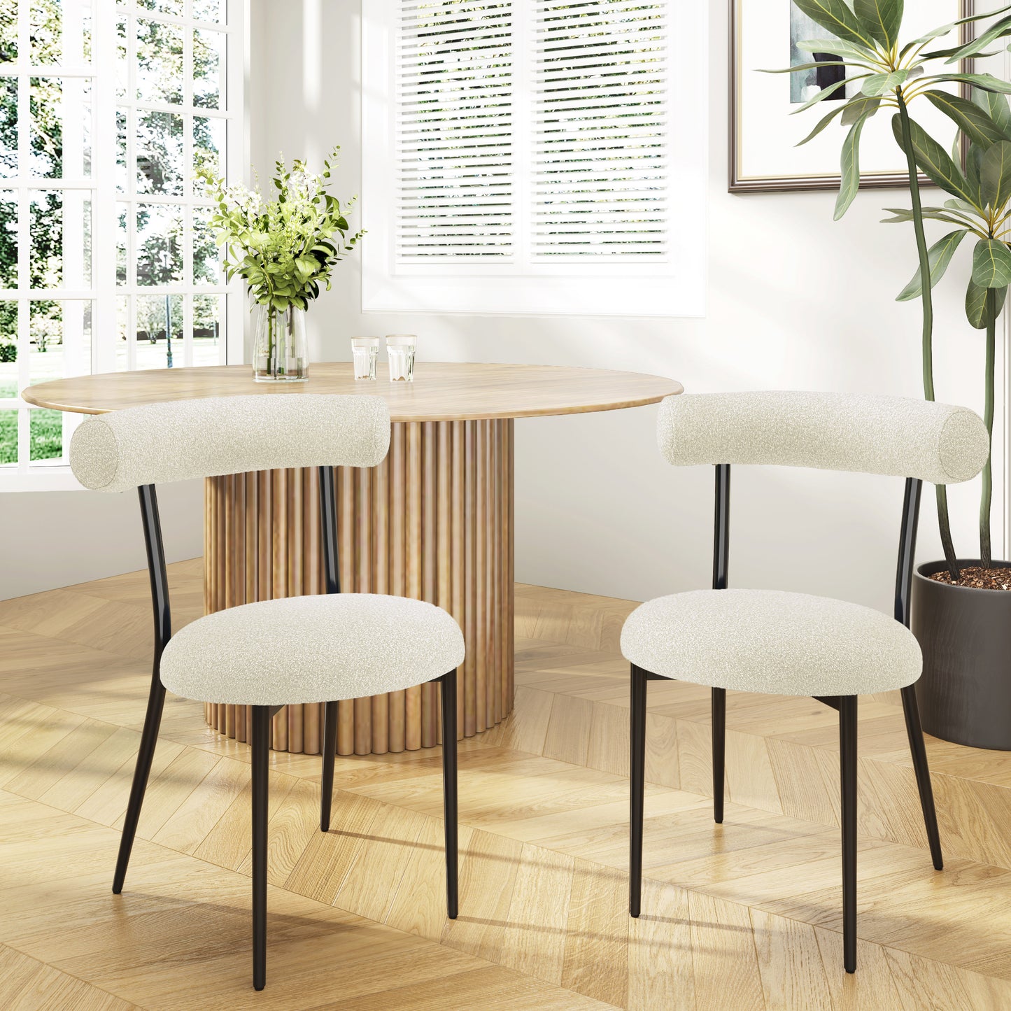 Cream boucle dining chair with black metal legs