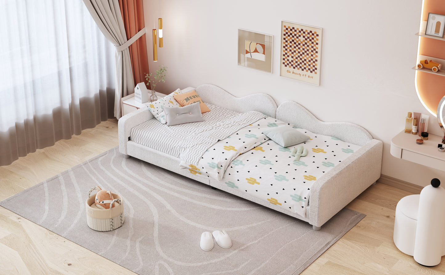 White boucl toddler bed with cactus print bedding and playful pillows