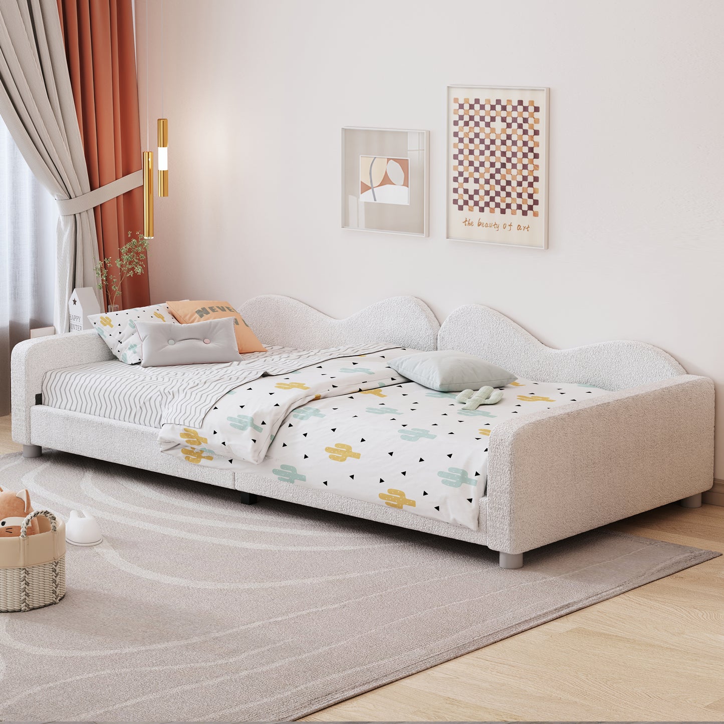 Fluffy white twin daybed with scalloped headboard and cactus print bedding