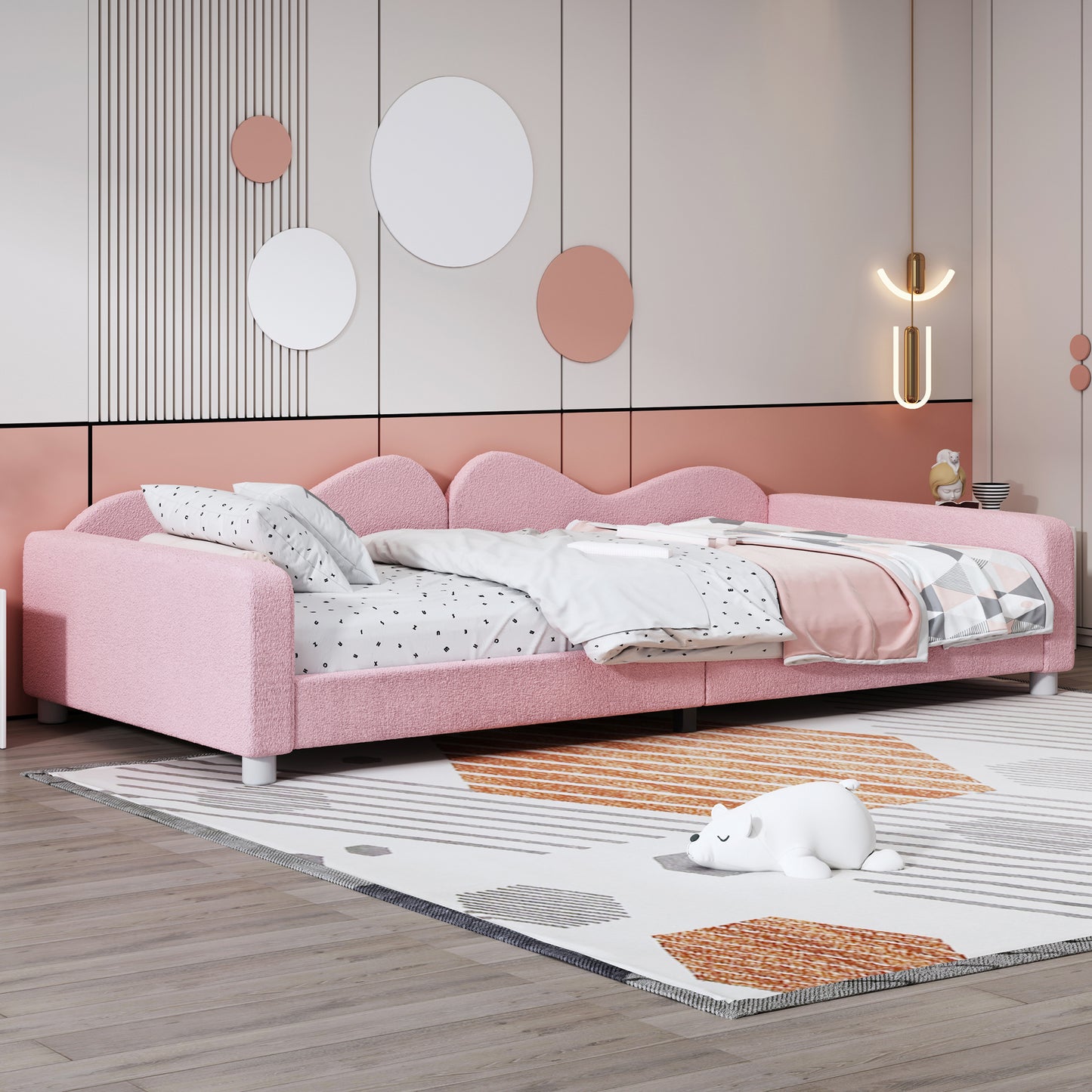 Fluffy pink twin daybed with waveshaped headboard and alphabet print bedding
