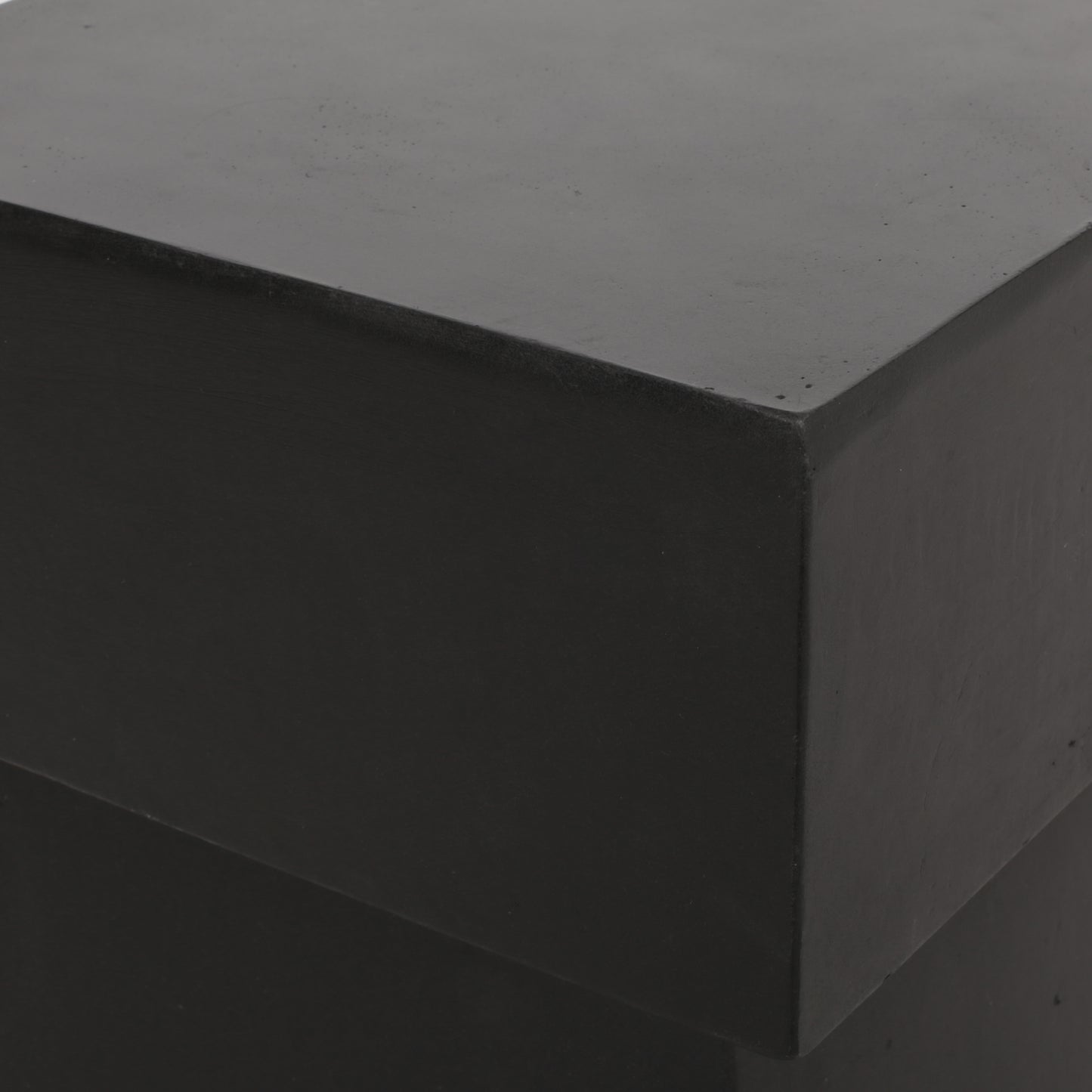 Matte black concrete cube stool with clean lines perfect for modern decor