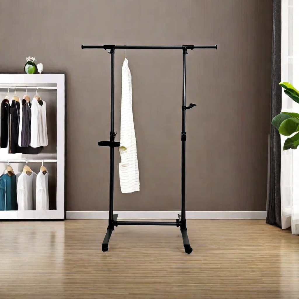 Black metal adjustable garment rack with a white towel hanging