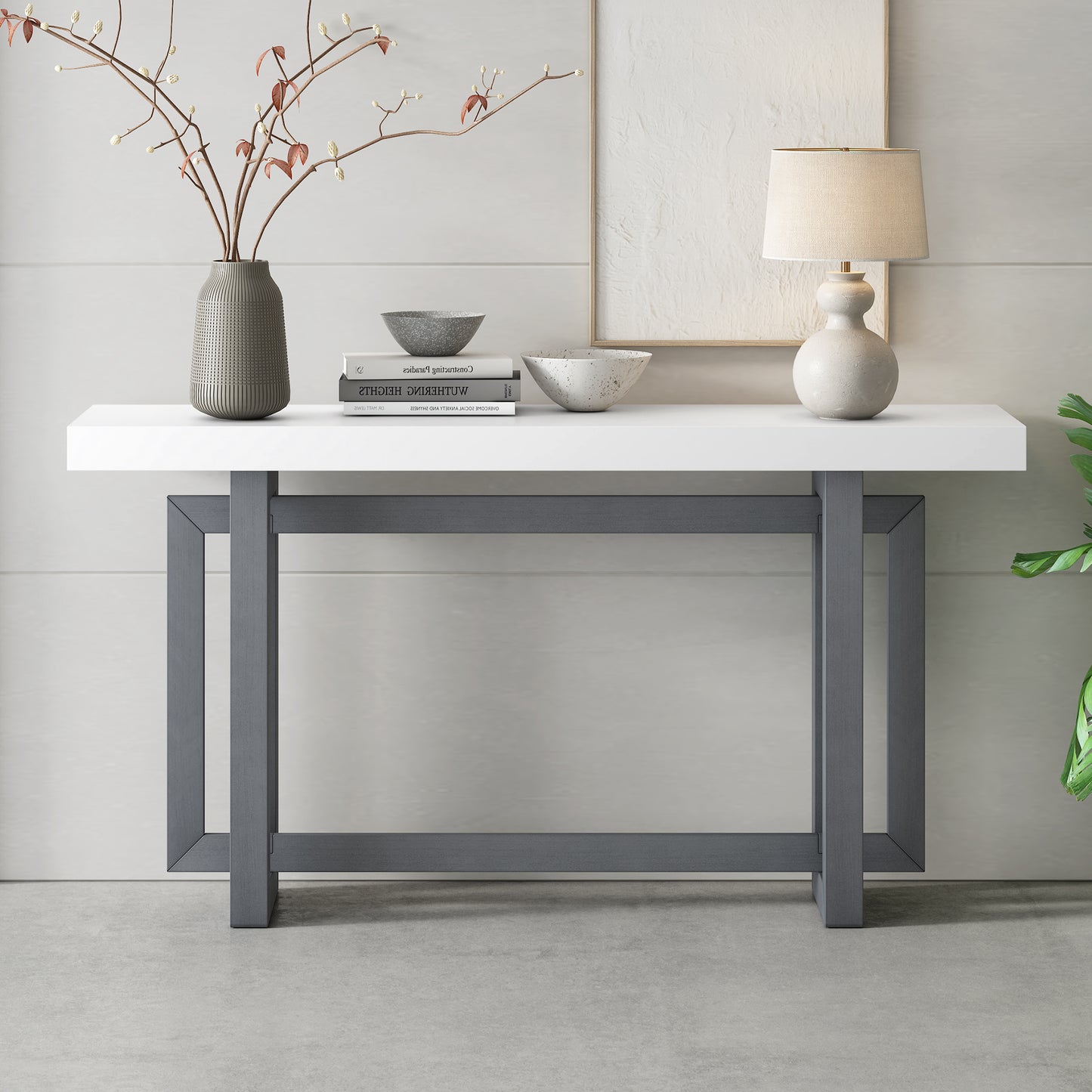 Modern white and grey metal frame console table with decorative objects