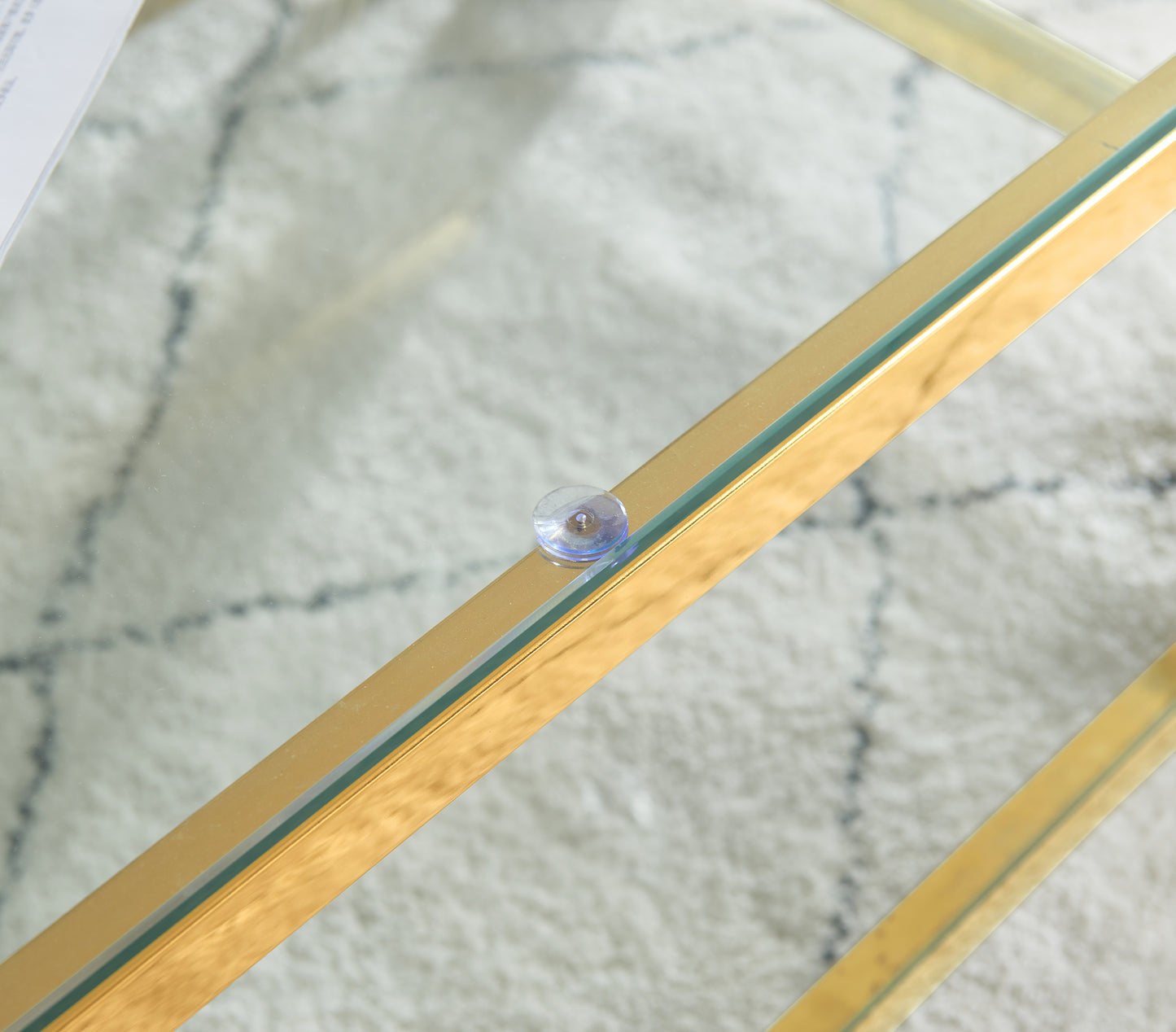 Gold metal accent on a glass table