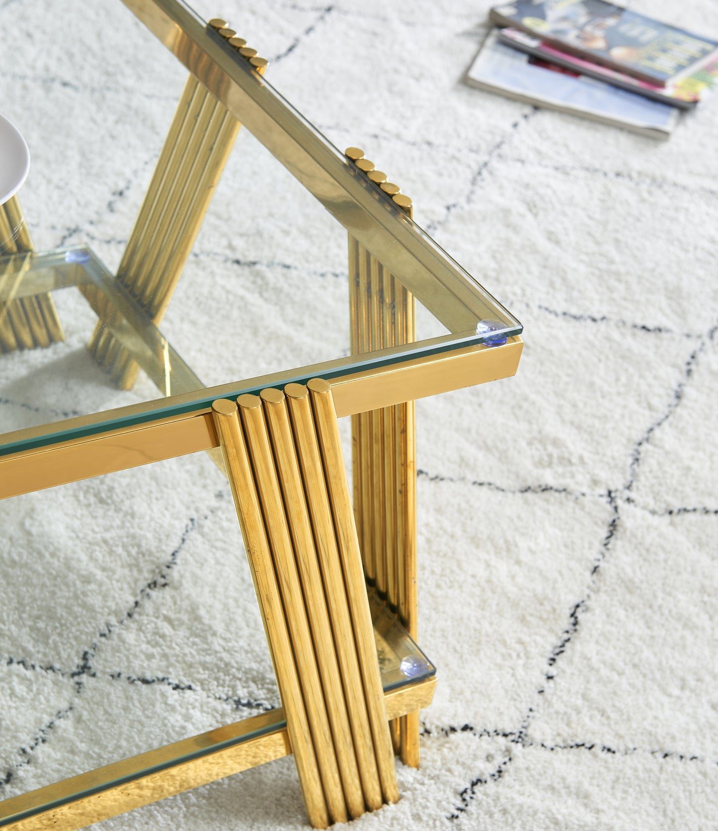 Gold frame glass coffee table with ribbed legs