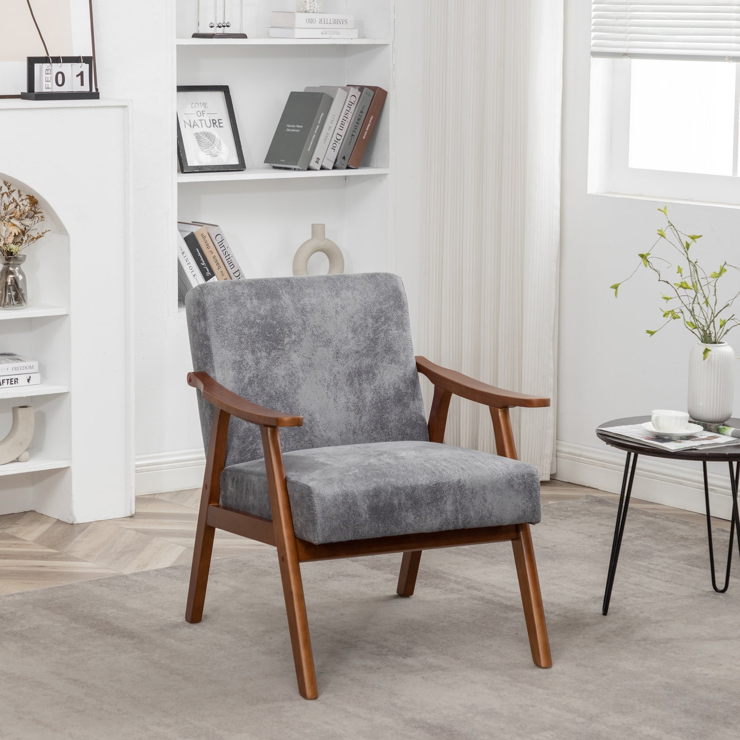 Grey fabric armchair with natural wood frame and arms