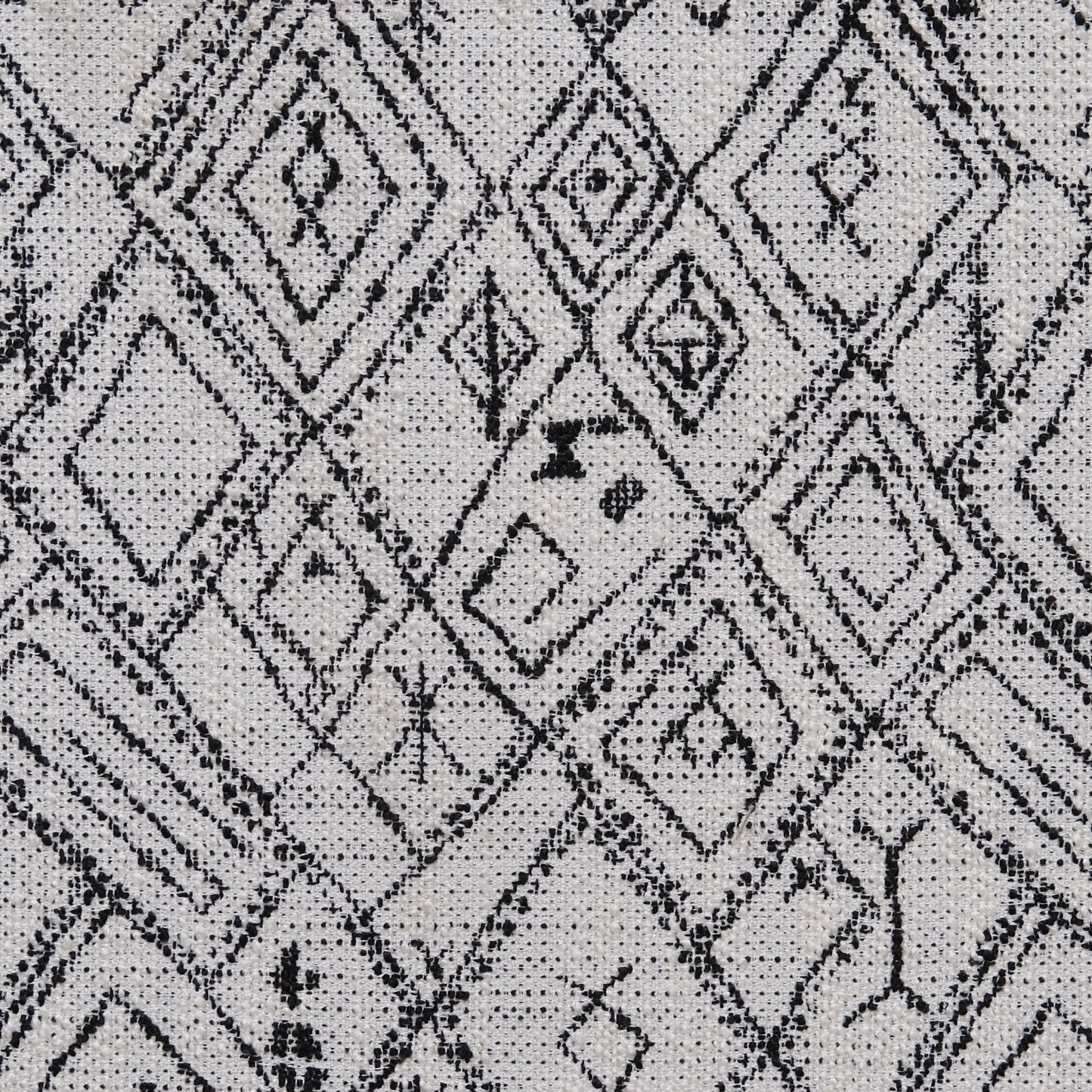 Black and white geometric diamond pattern on textured fabric