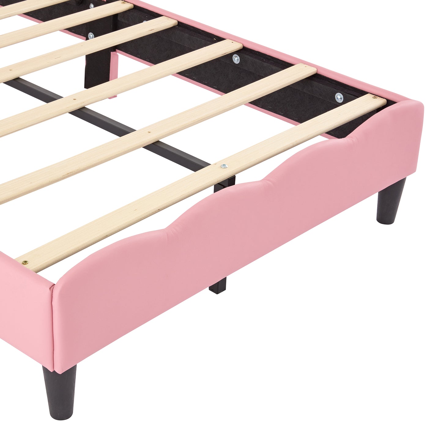 Pink upholstered bed frame with scalloped headboard and wooden slats