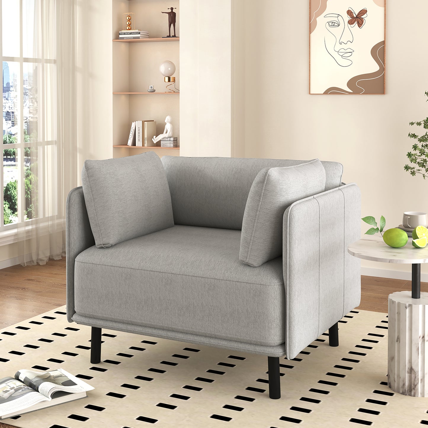 Comfortable grey armchair with plush cushions and modern black legs