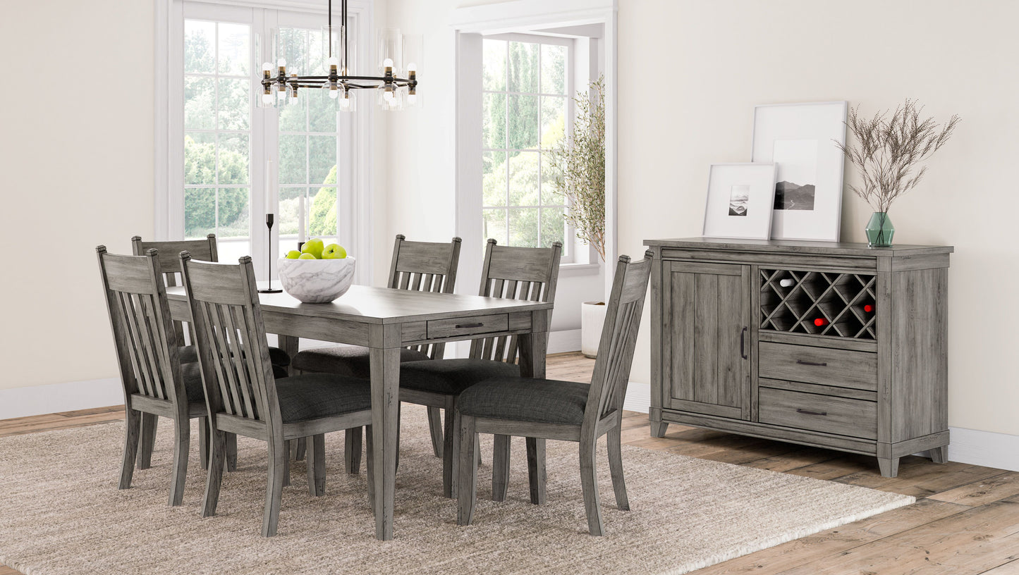 Grey wood dining table with six chairs and a buffet server