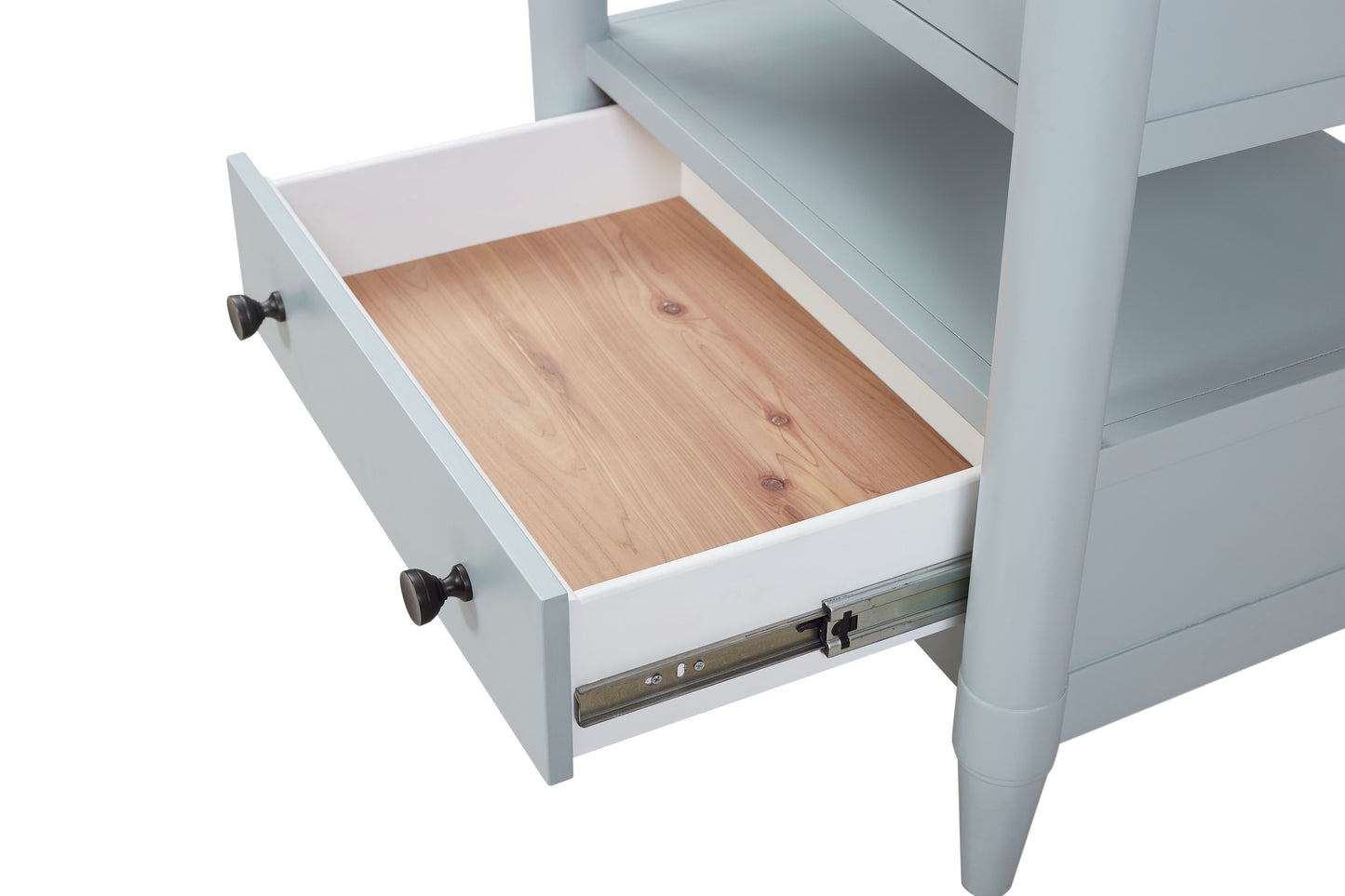 Light grey dresser drawer with wooden interior and dark knob