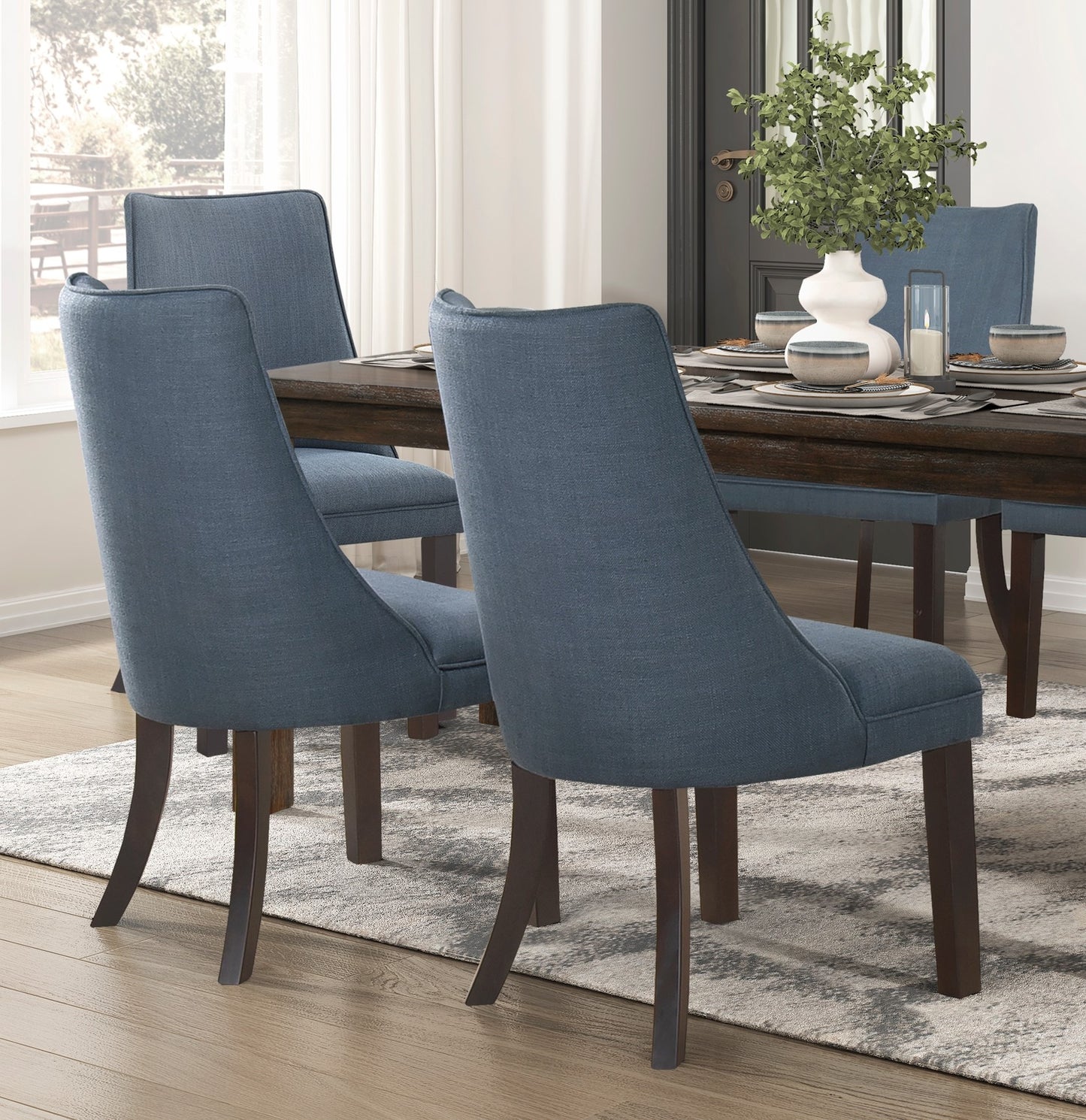Set of blue upholstered dining chairs with dark wood legs modern style