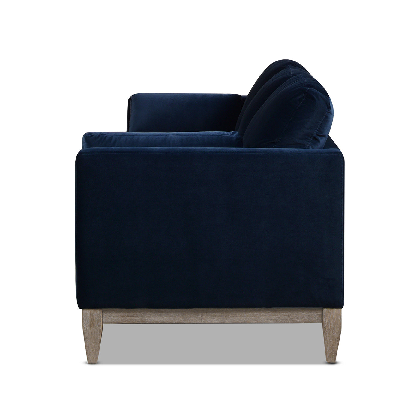 Navy velvet sofa with plush cushions and natural wood legs