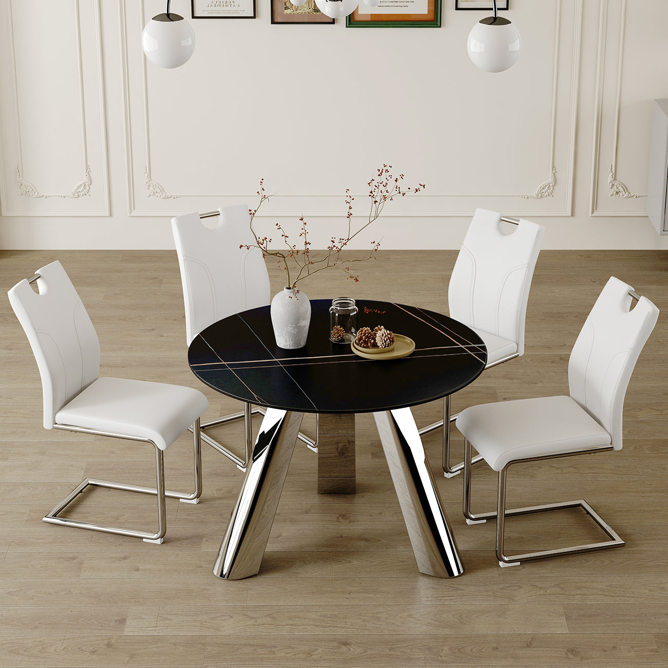 Round black dining table with chrome legs and white faux leather chairs