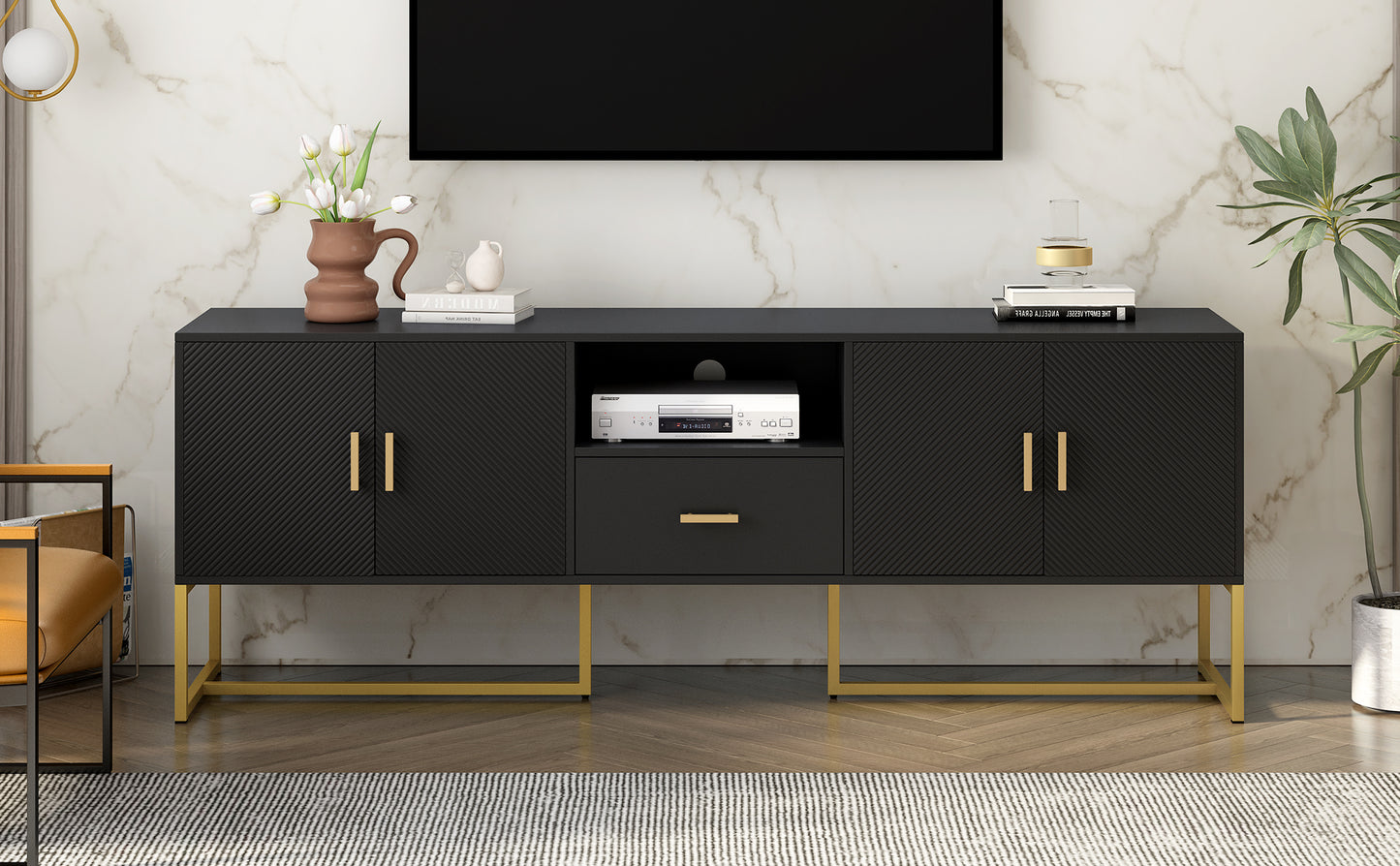 Black media console with gold legs and ribbed doors
