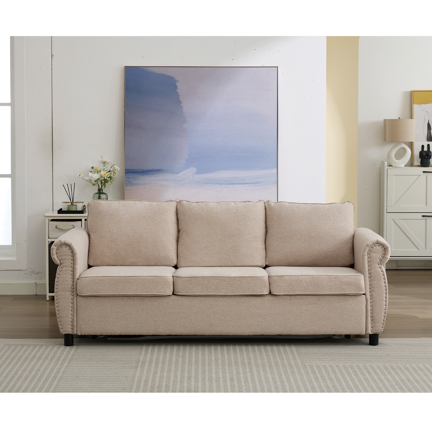 Beige linen sofa with nailhead trim