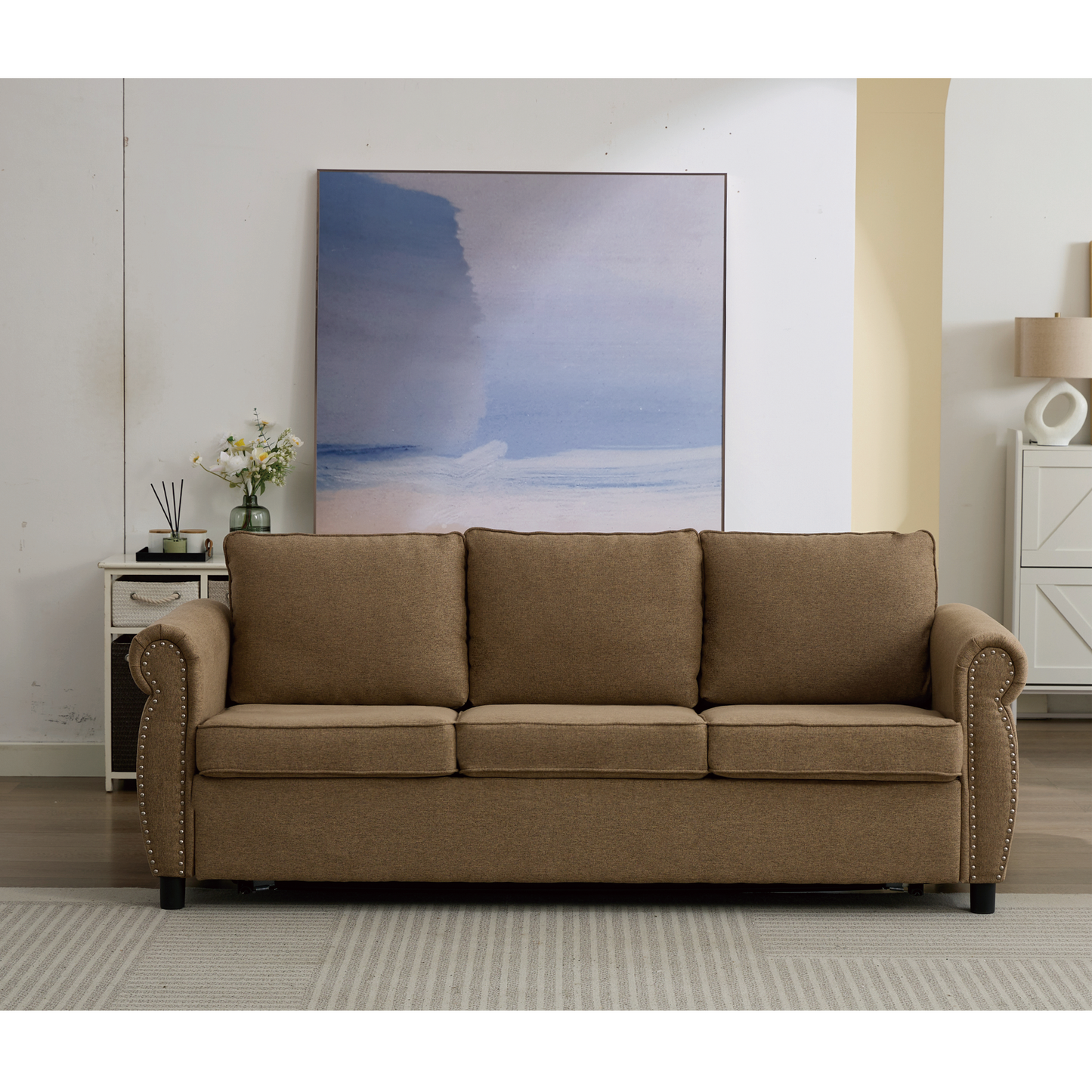 Brown upholstered seater sofa with nailhead trim