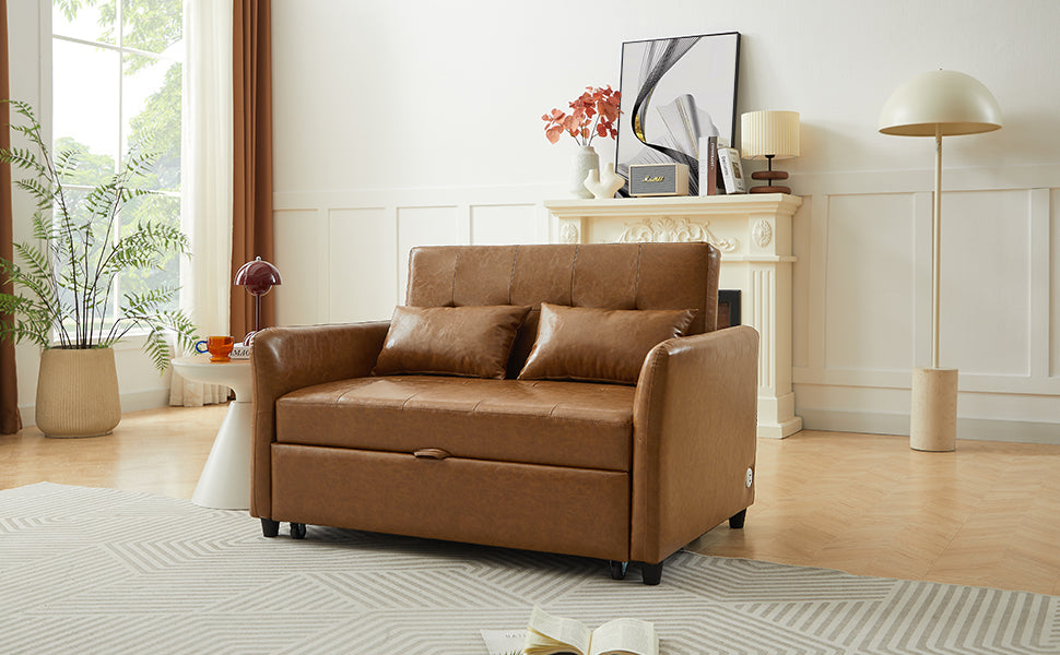 Brown faux leather loveseat sleeper with two accent pillows