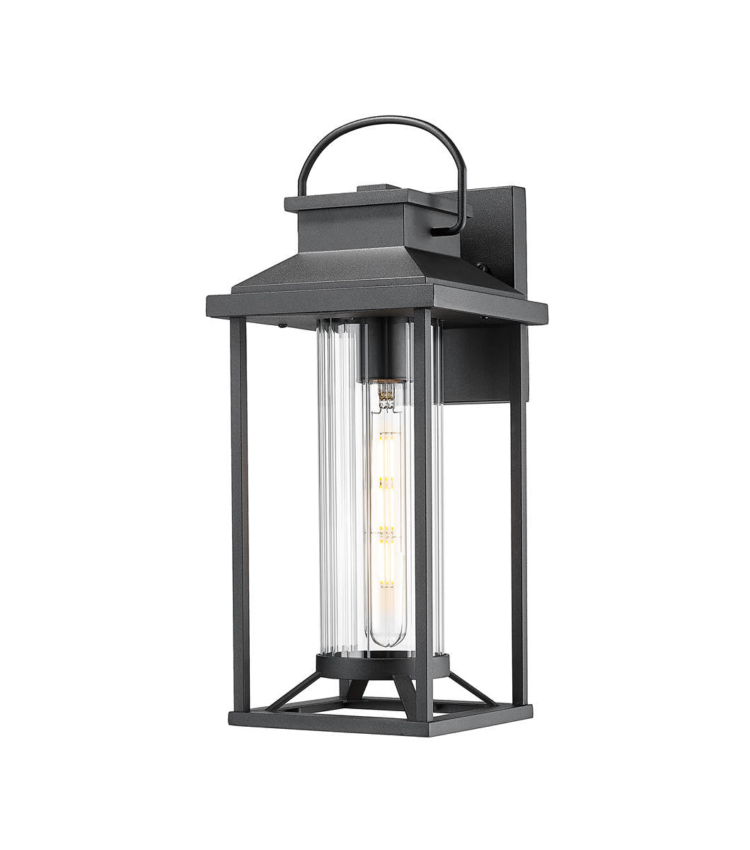Black metal outdoor wall lantern with clear glass cylinder shade