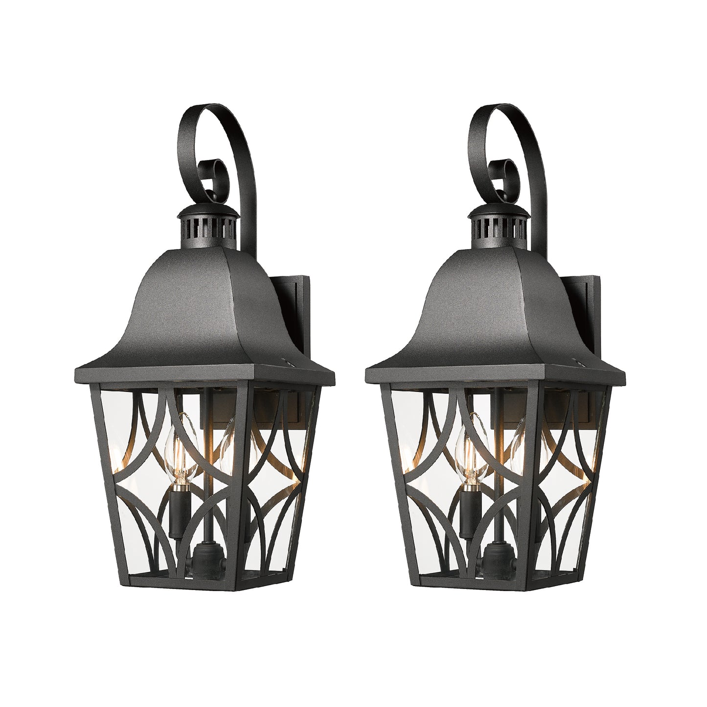 Pair of black metal outdoor wall lanterns with clear glass panels and decorative scrollwork
