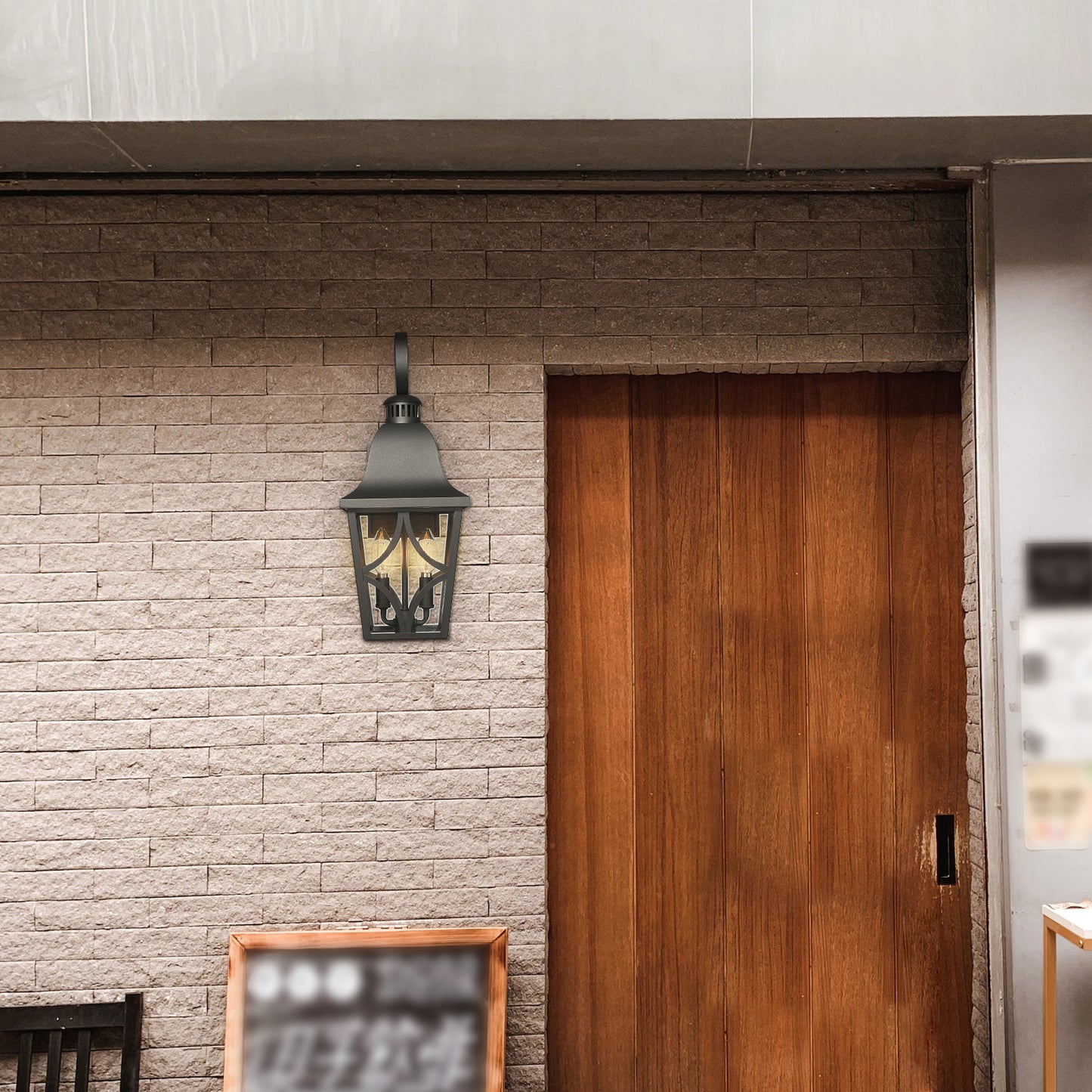 Black cast iron outdoor lantern with clear glass panels