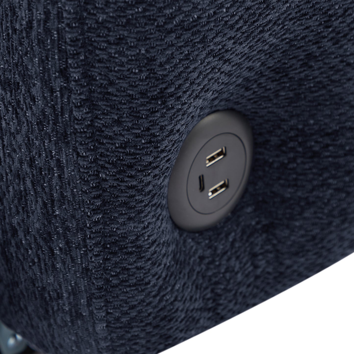 Close up of navy blue textured fabric armchair with builtin USB charging port