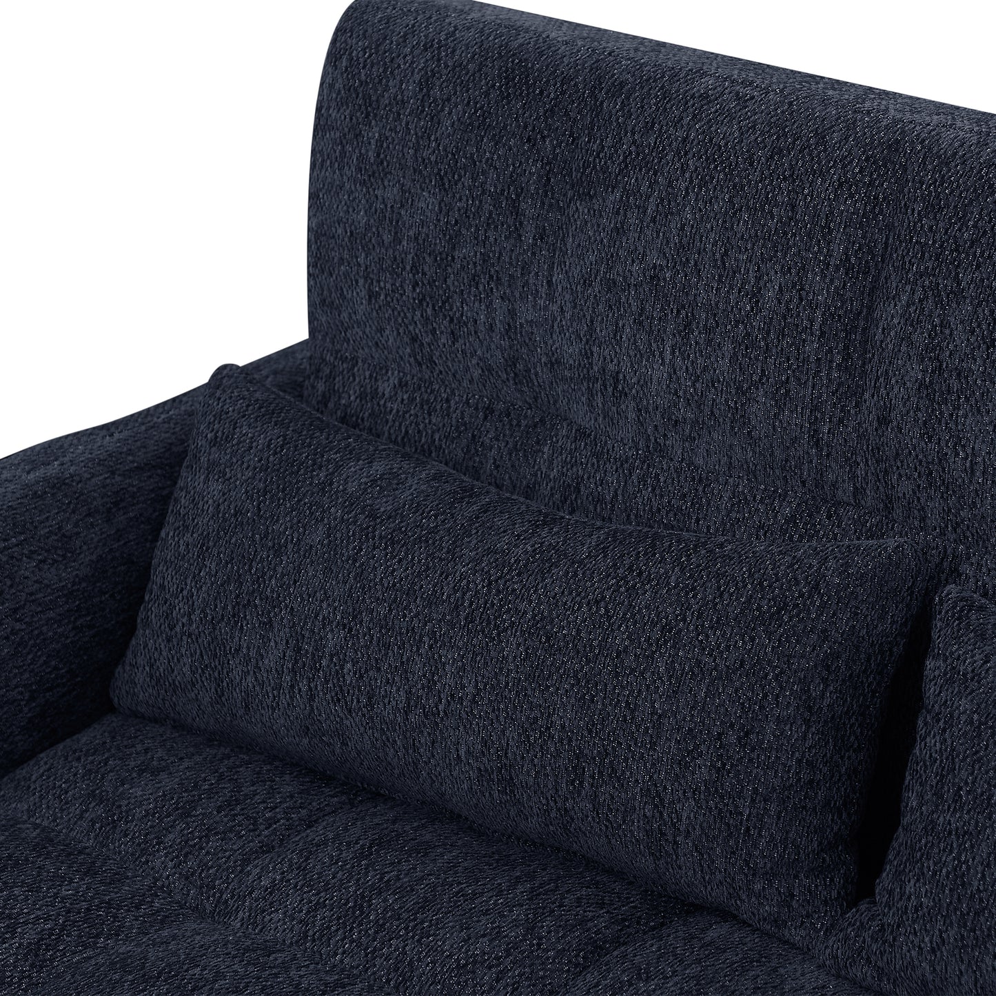 Closeup of a textured dark blue fabric sofa with a lumbar pillow