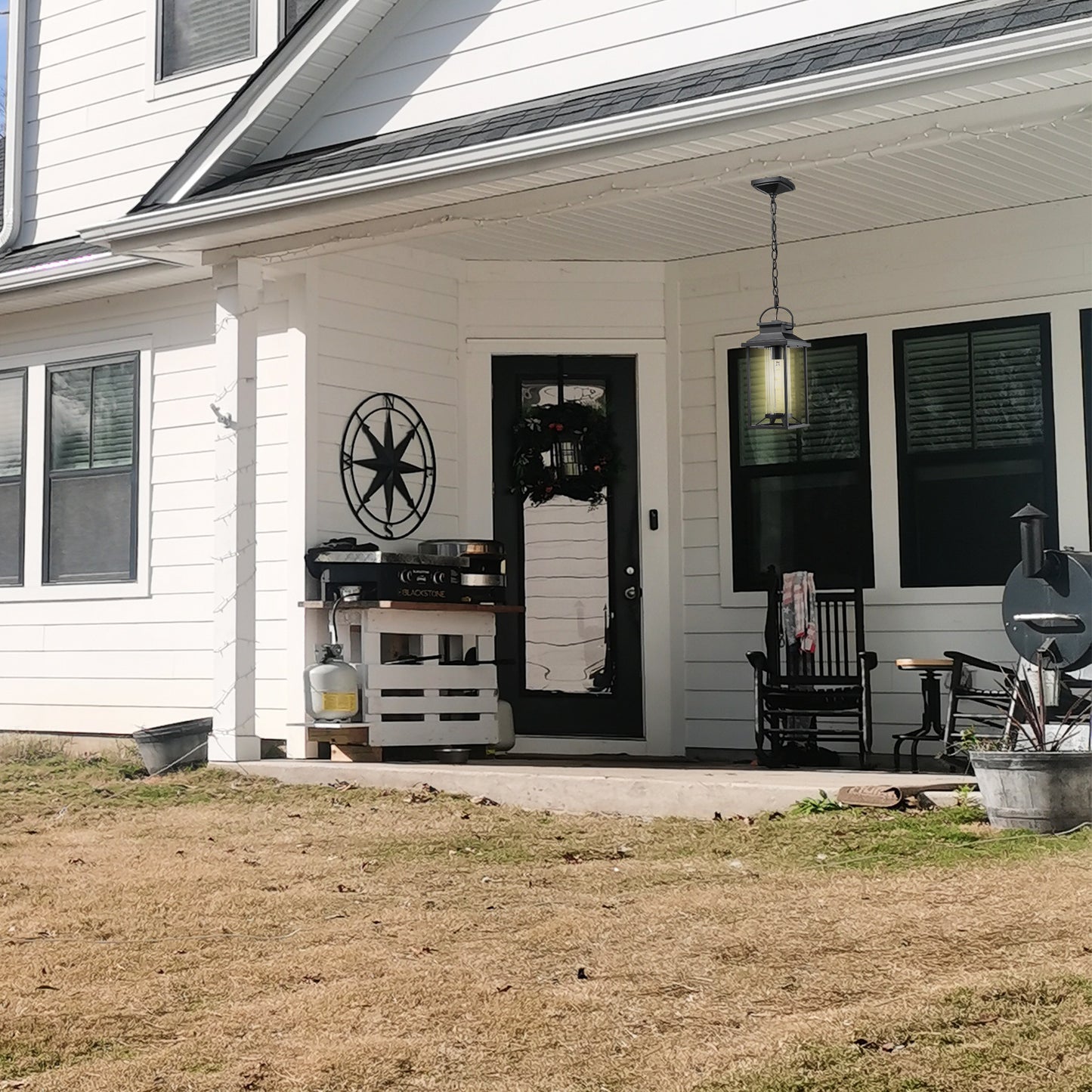 Black metal porch lantern with clear glass panels