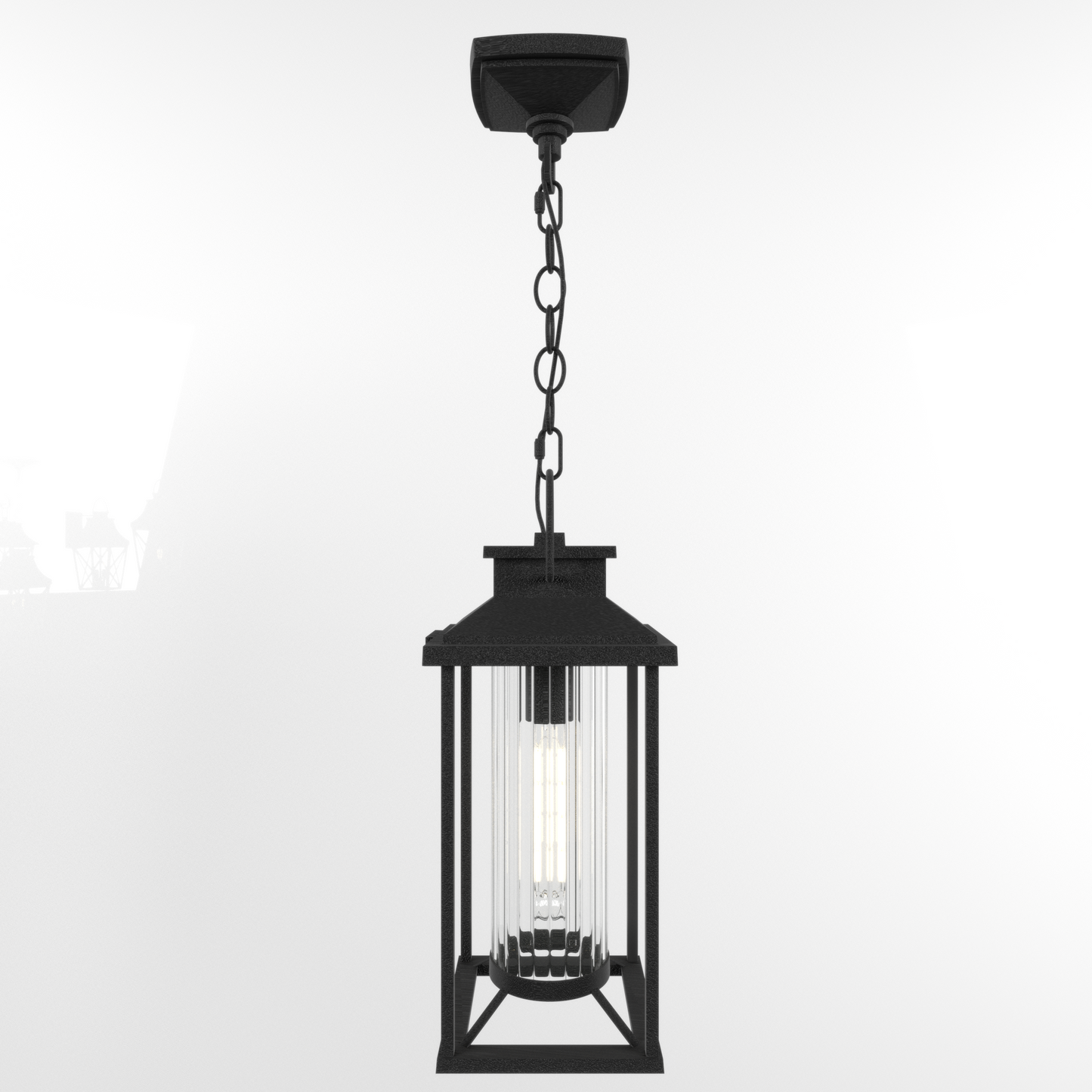 Black metal hanging lantern with clear fluted glass cylinder and exposed filament bulb
