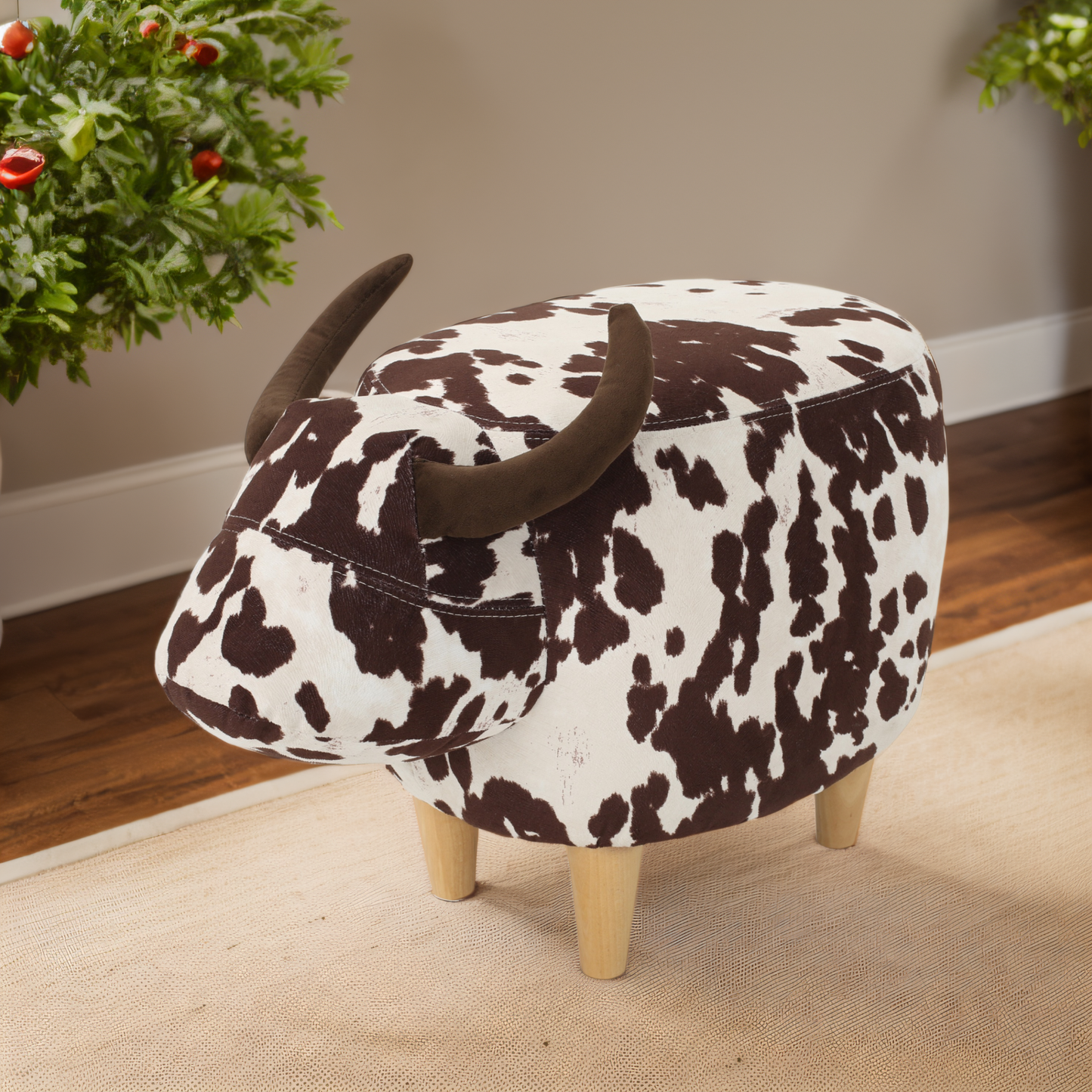 Cow print ottoman with horns and wooden legs