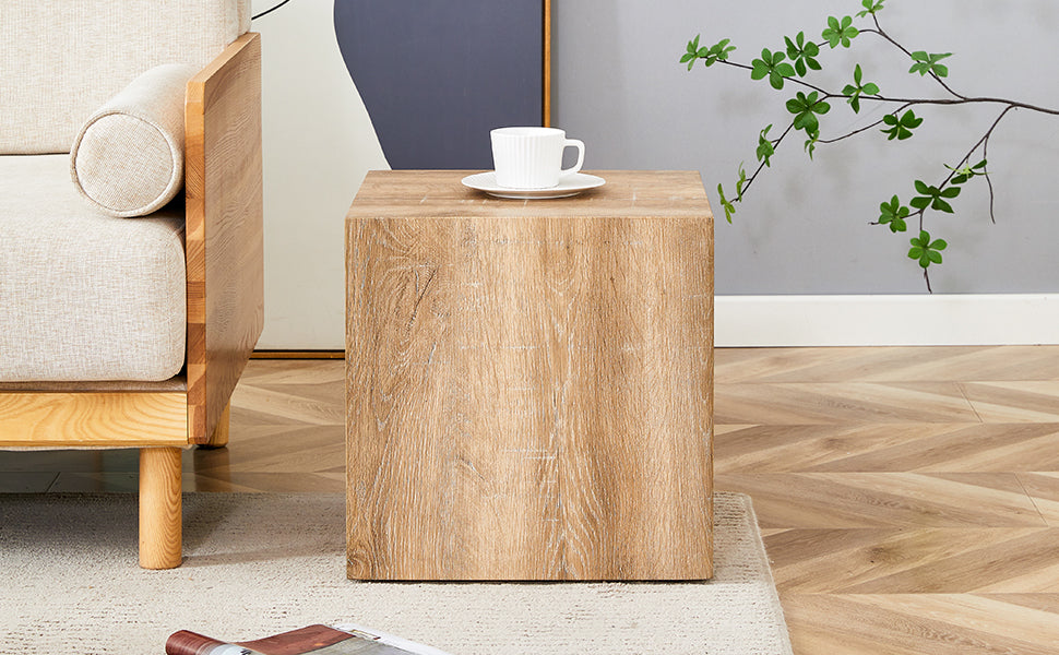 Textured wood cube end table with a white mug and saucer