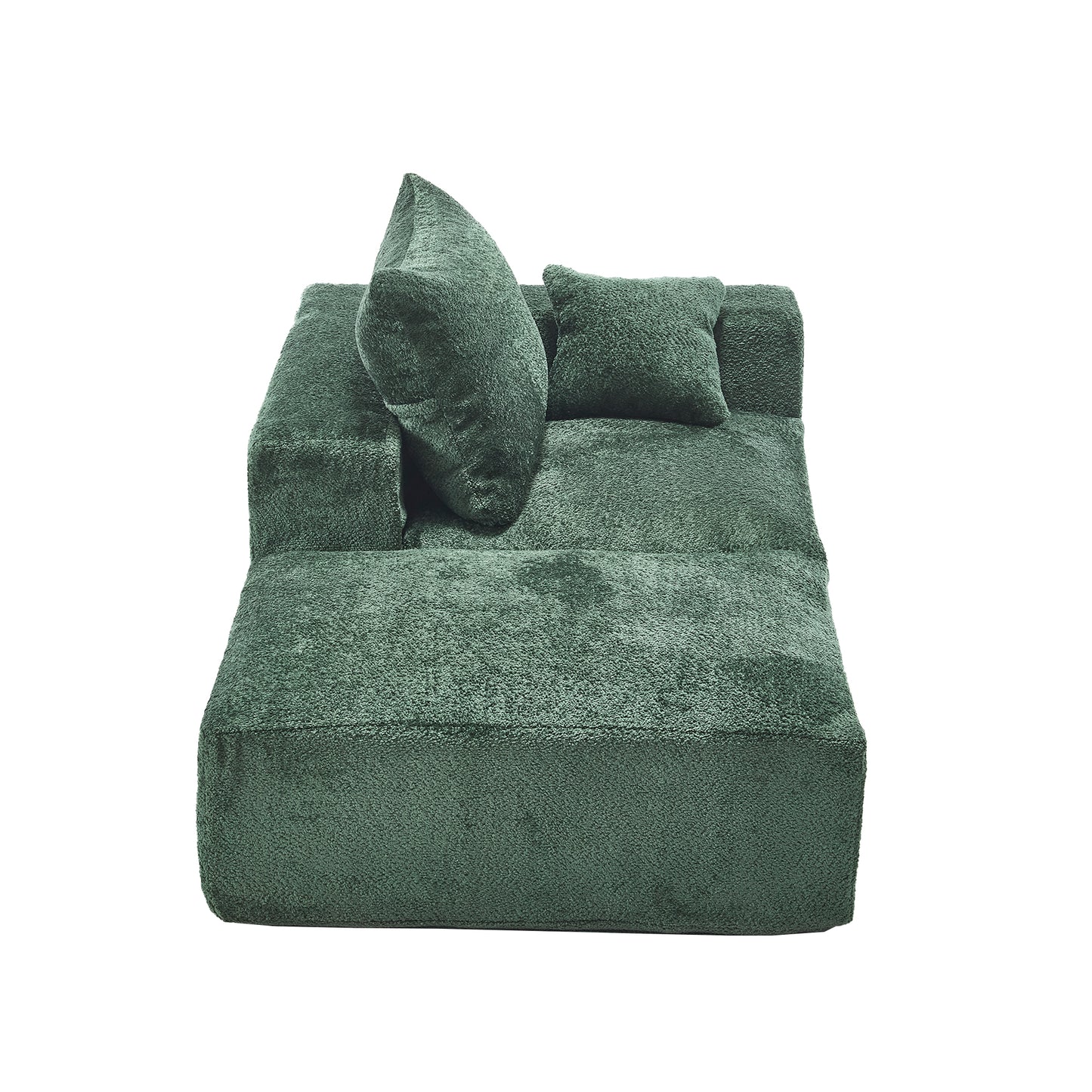 Plush emerald green velvet modular sofa with two accent pillows