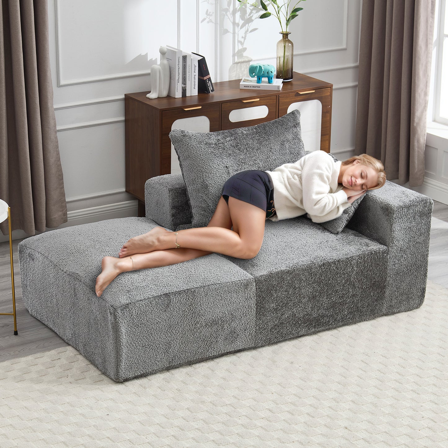 Comfortable grey boucl modular sofa with a chaise lounge perfect for relaxation