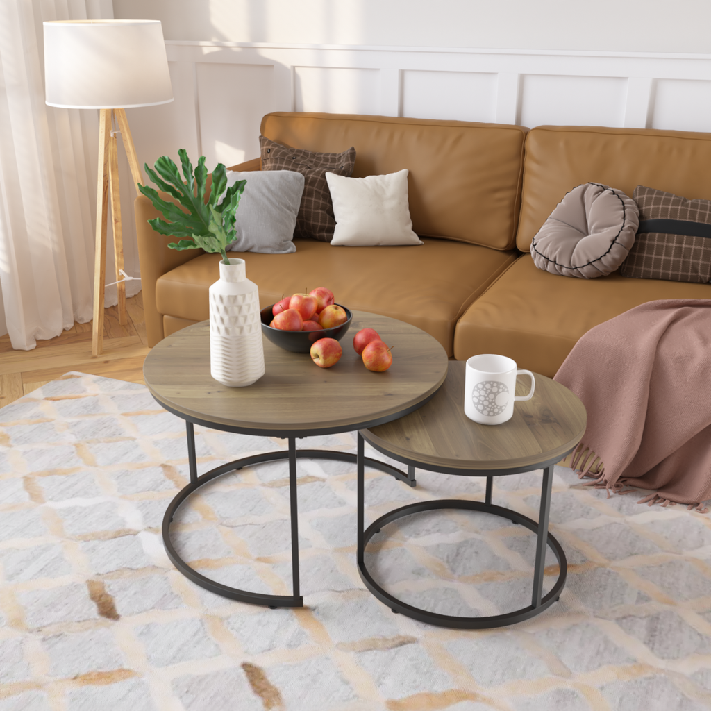 Round nesting coffee tables with distressed wood tops and black metal legs
