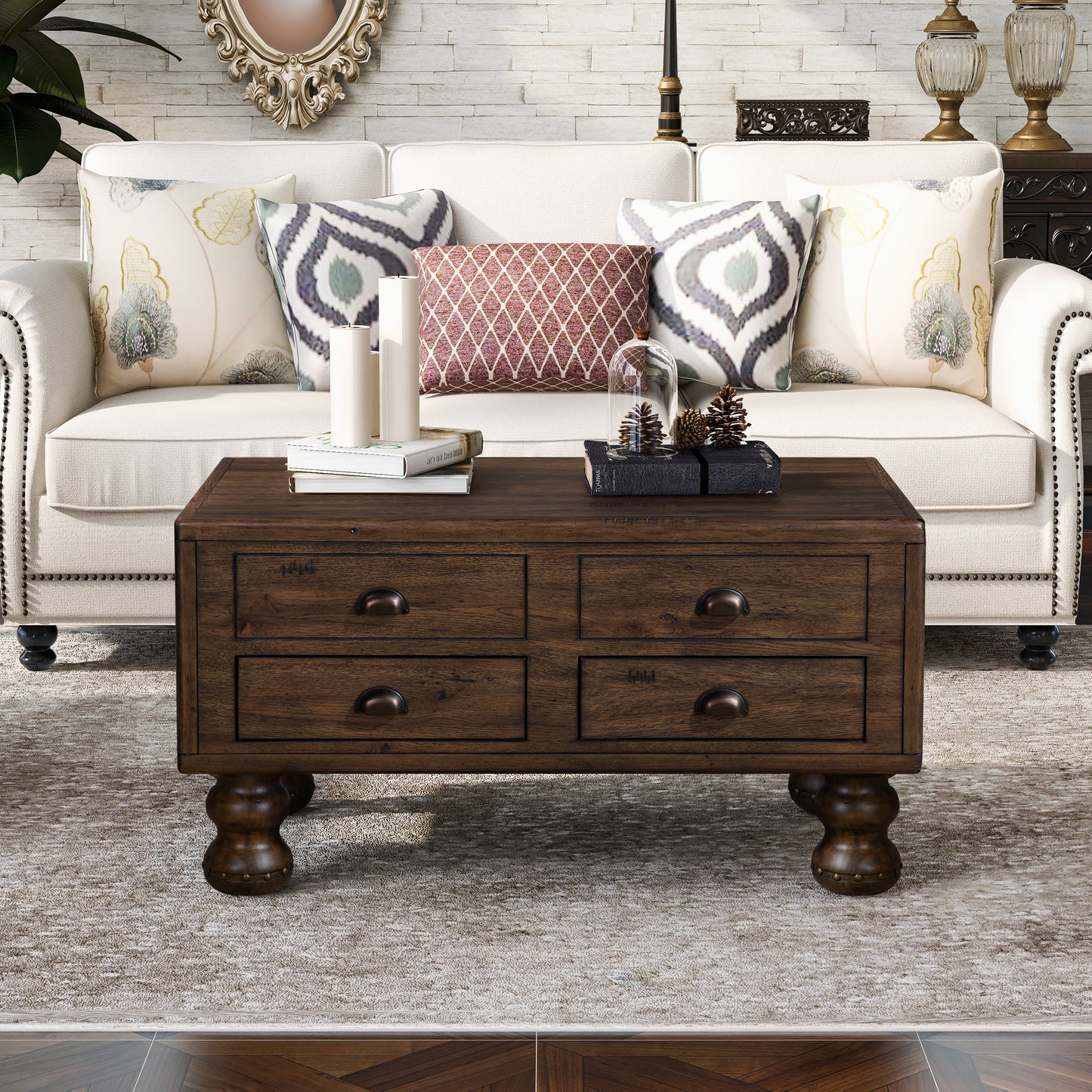 Dark wood coffee table with four drawers and antique bronze pulls on ornate legs