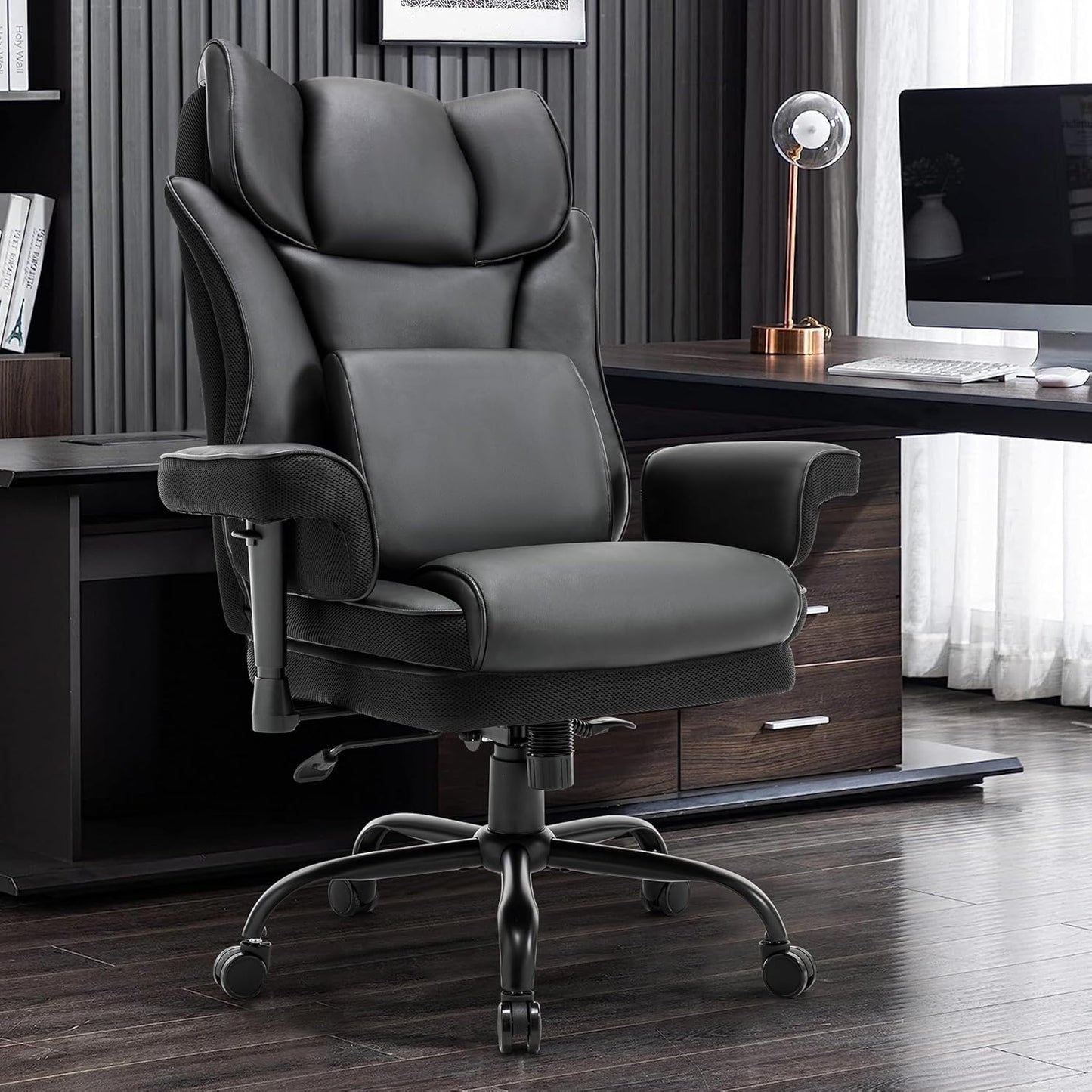 Black executive office chair with padded headrest and lumbar support