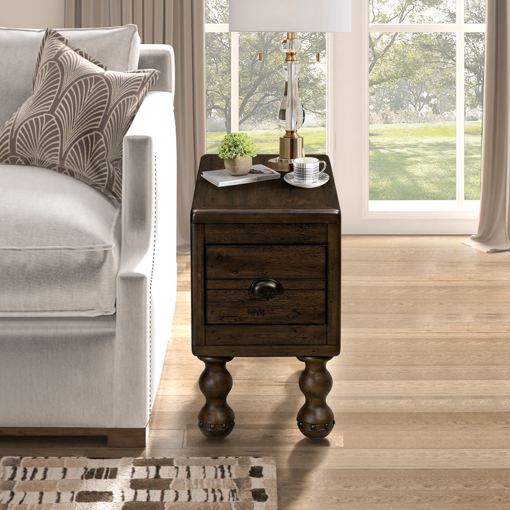 Dark wood end table with turned legs and a single drawer