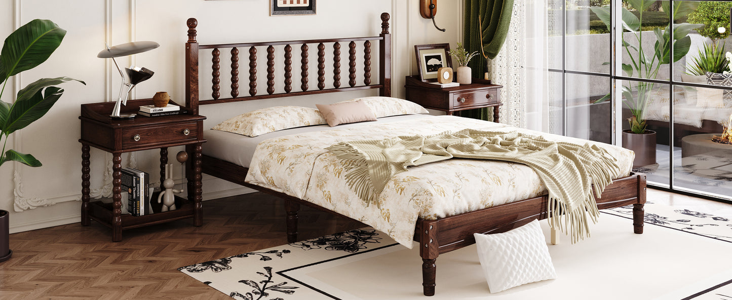 Dark wood spindle bed frame with floral bedding and cream throw