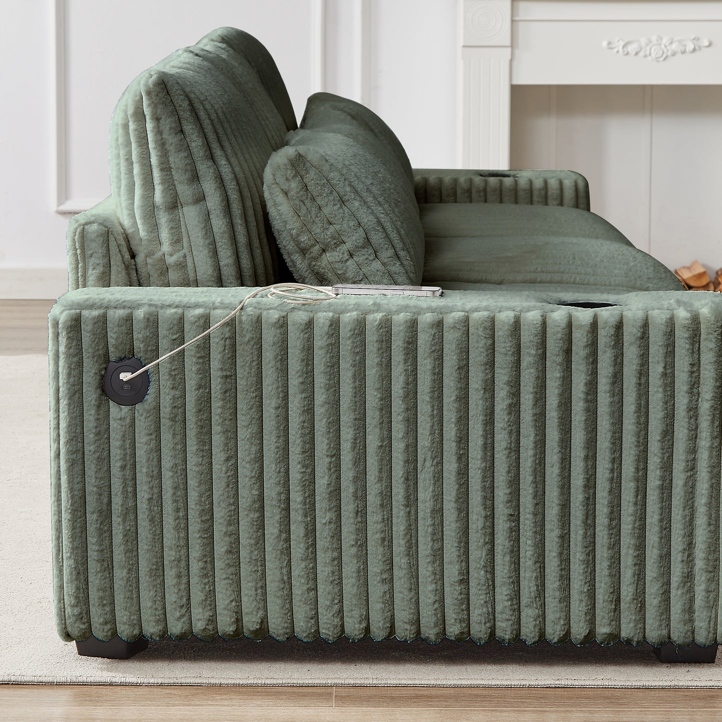 Sage green corduroy sofa with plush cushions and builtin charging port