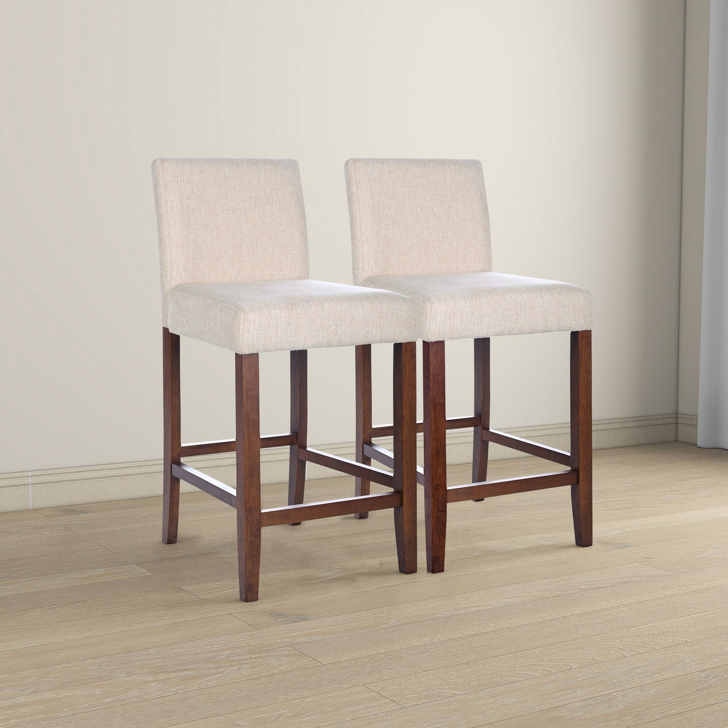 Two beige upholstered bar stools with dark wood legs
