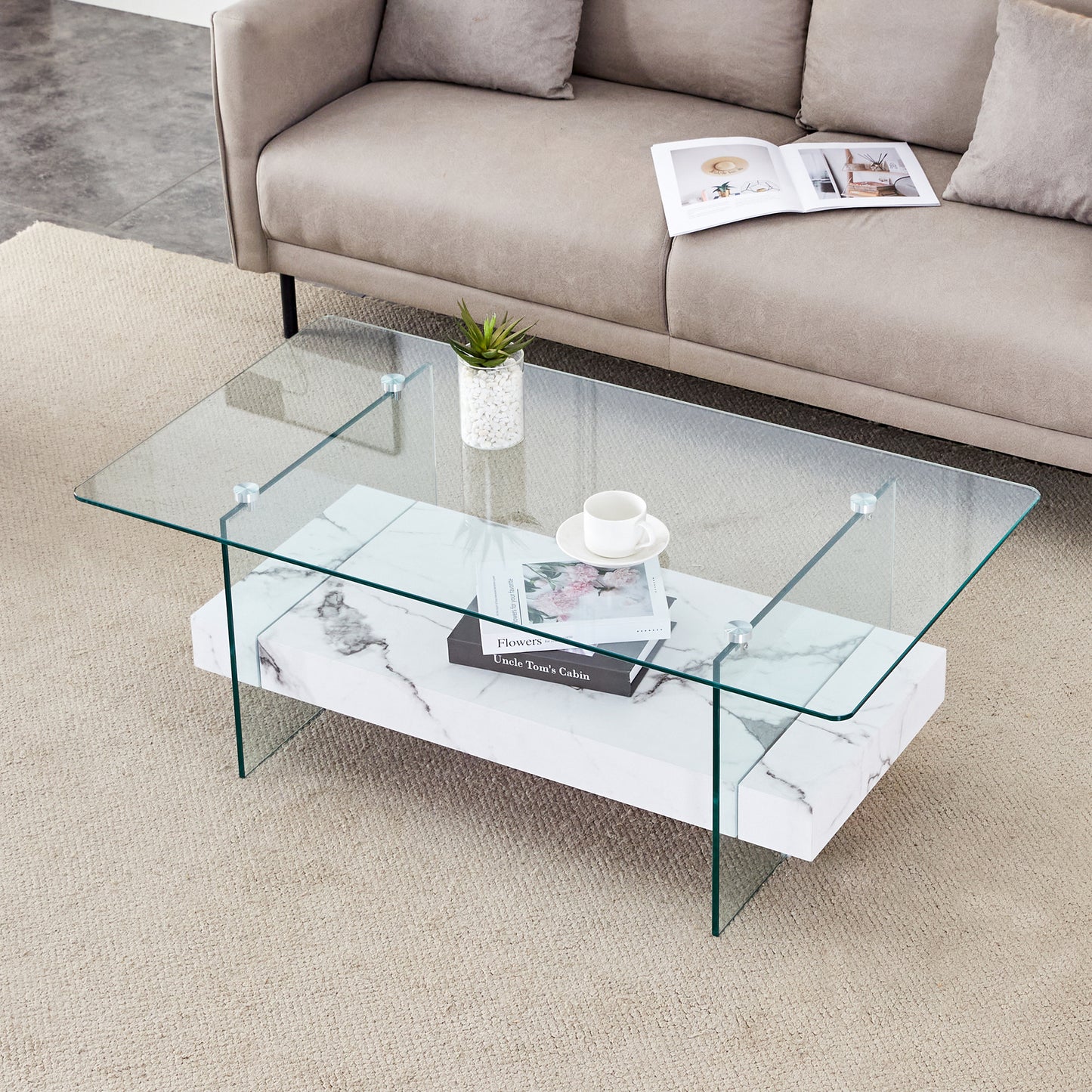 Modern glass coffee table with marble effect base and chrome accents