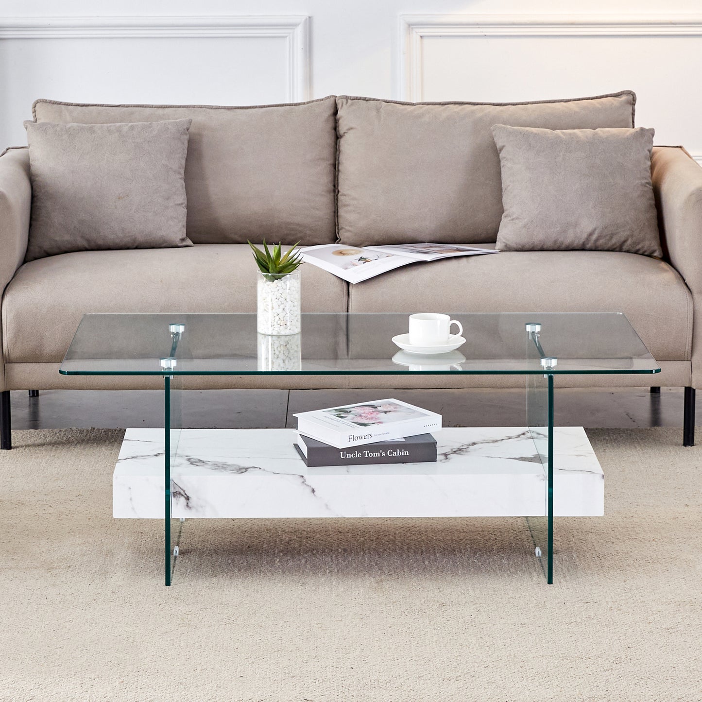 Modern clear glass coffee table with marble base