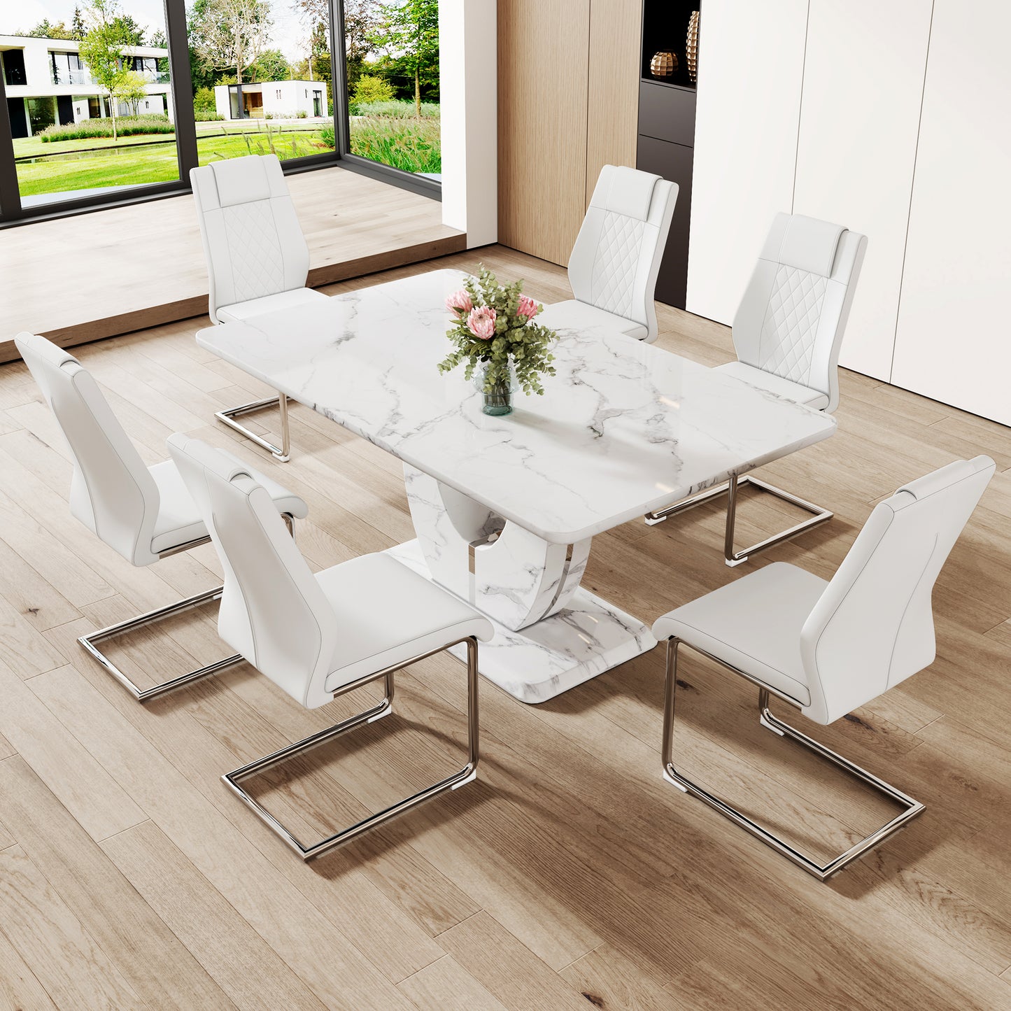 White faux leather dining chairs with diamondstitched backs around a modern marble dining table set
