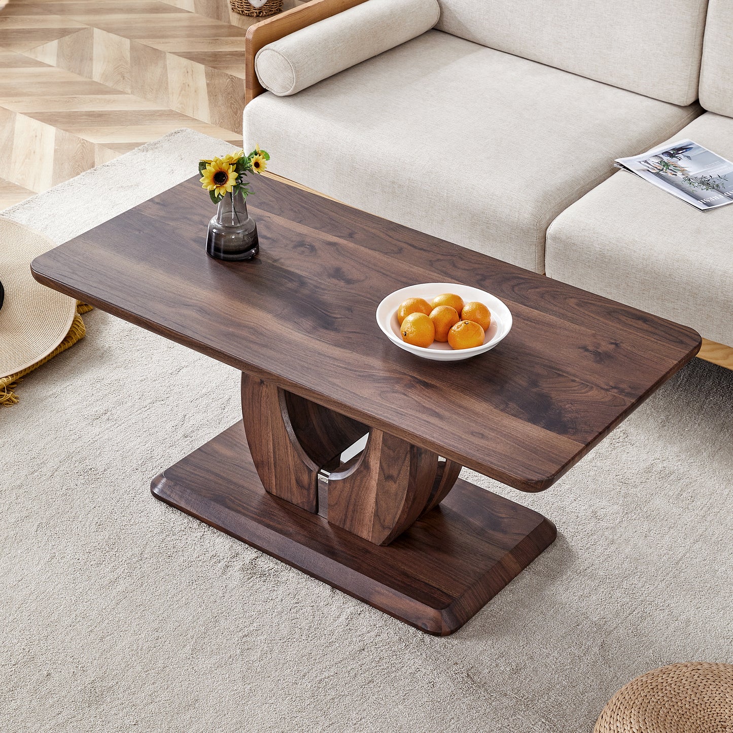 Dark walnut coffee table with curved base and modern design