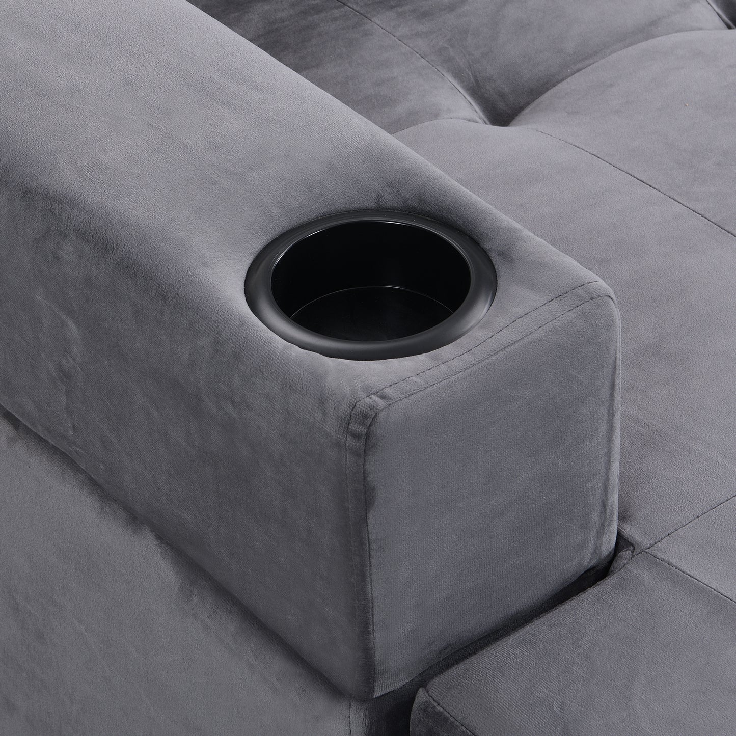 Gray velvet armchair with integrated cup holder