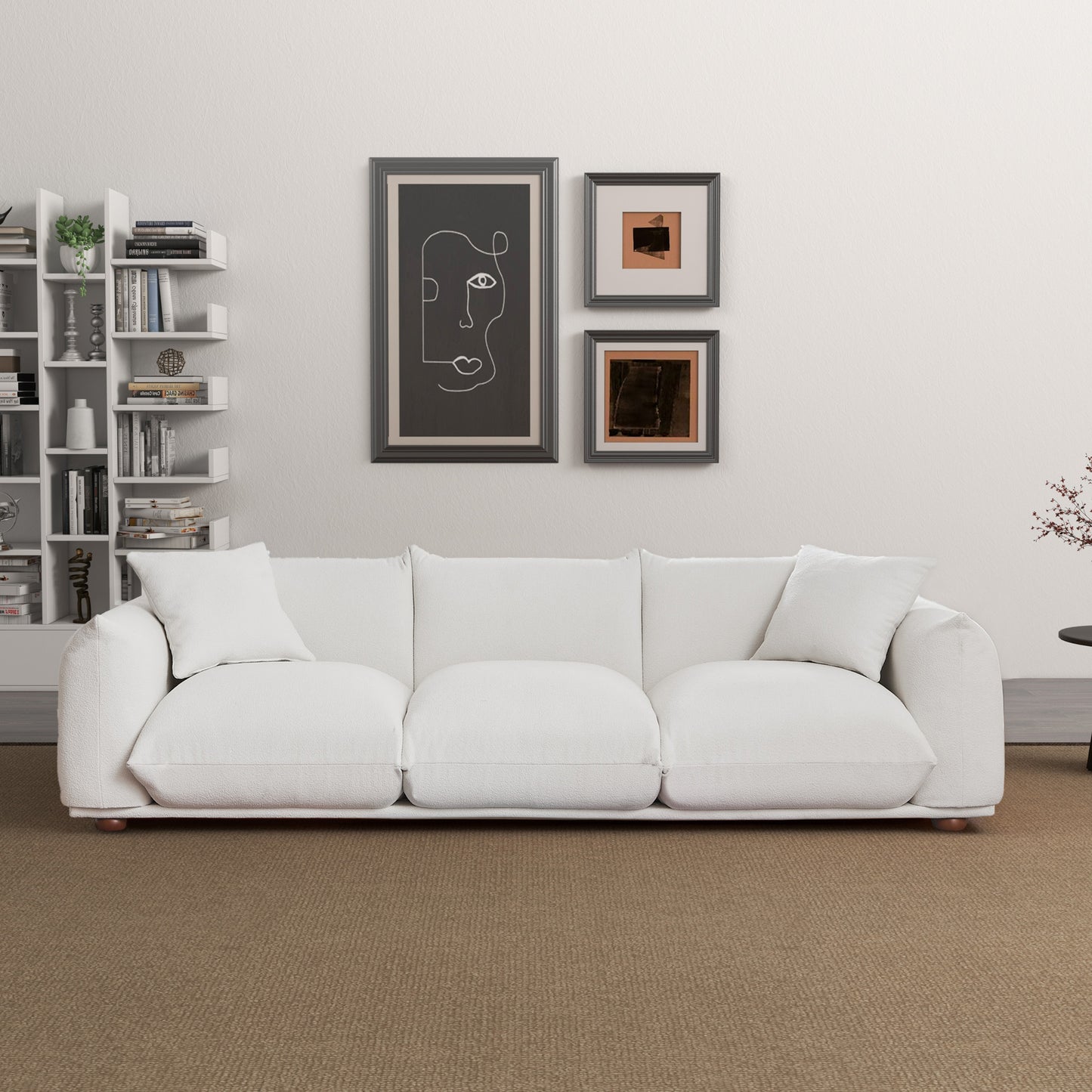 Plush white threeseater sofa with textured fabric and wooden legs
