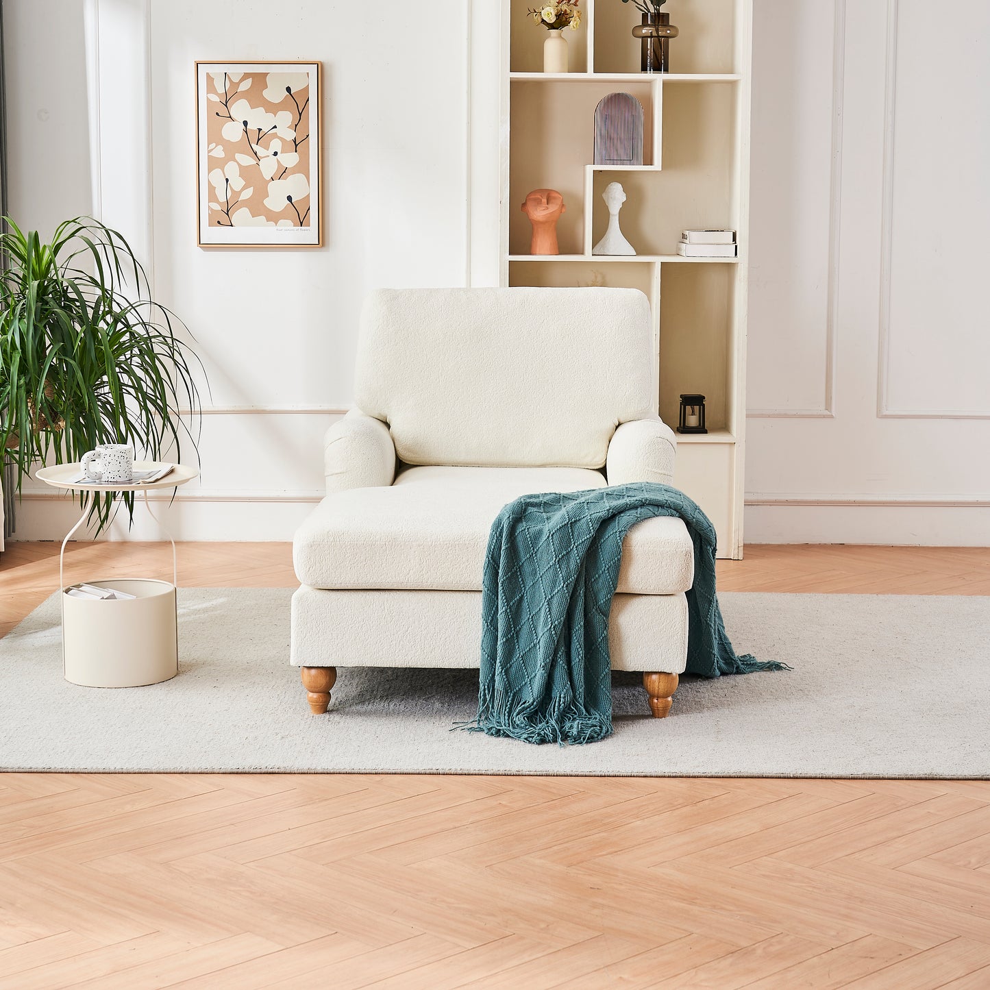 Cream boucle chaise lounge with teal throw