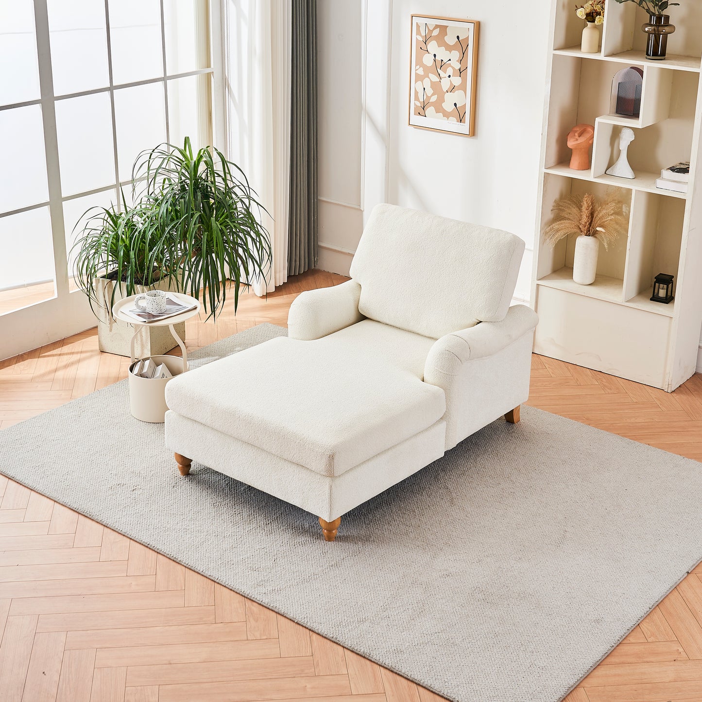 Plush white chaise lounge with wooden legs in a sunlit living room